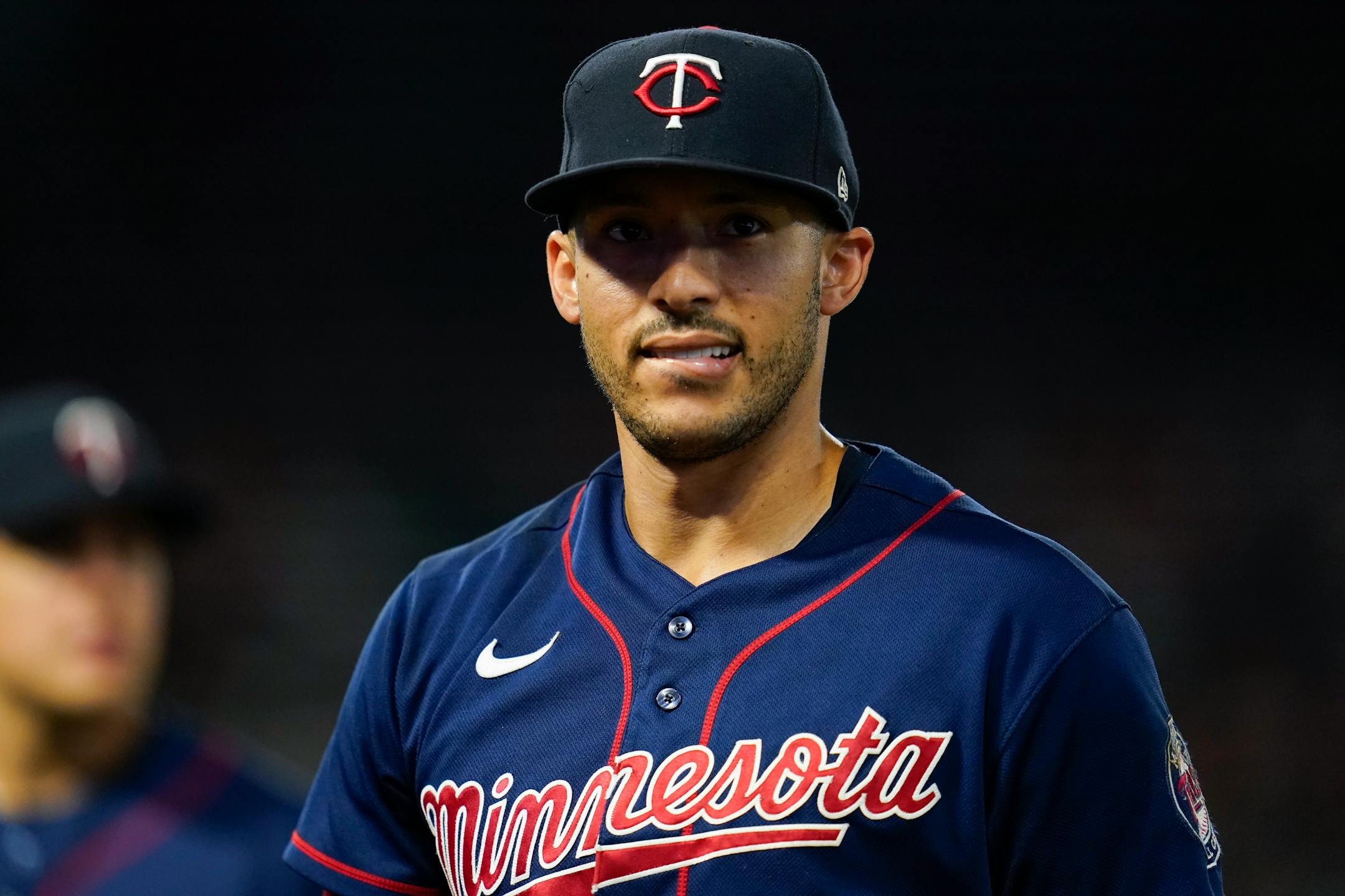 Minnesota Twins shortstop Carlos Correa (4) walks back to the dugout between the seventh and eighth innings of a baseball game against the Los Angeles Angels in Anaheim, Calif., Friday, Aug. 12, 2022. (AP Photo/Ashley Landis)