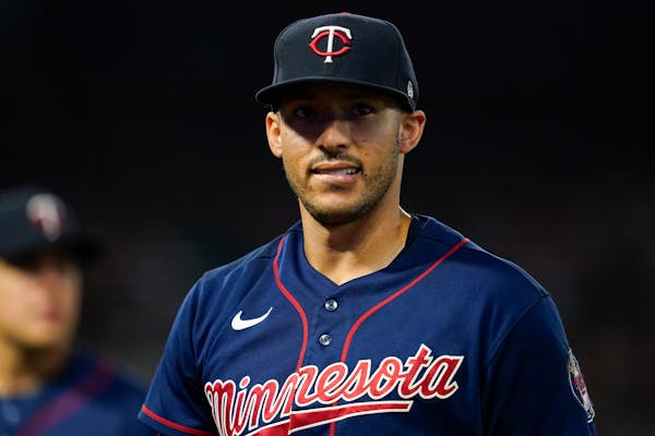 Minnesota Twins shortstop Carlos Correa (4) walks back to the dugout between the seventh and eighth innings of a baseball game against the Los Angeles