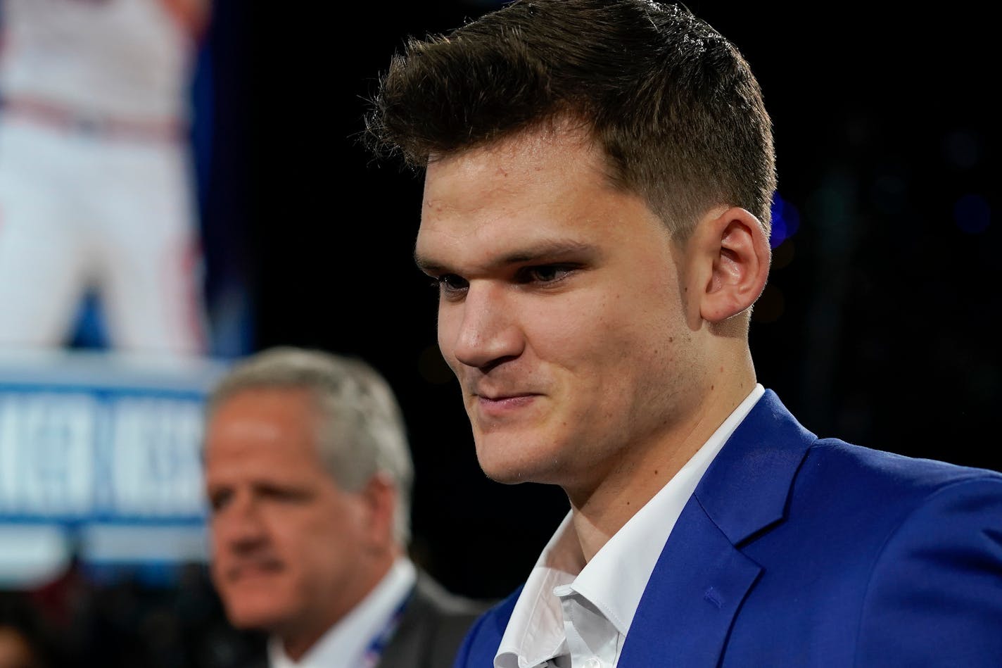 Walker Kessler walks to the stage after being selected 22nd overall by the Memphis Grizzlies in the NBA basketball draft, Thursday, June 23, 2022, in New York. (AP Photo/John Minchillo)