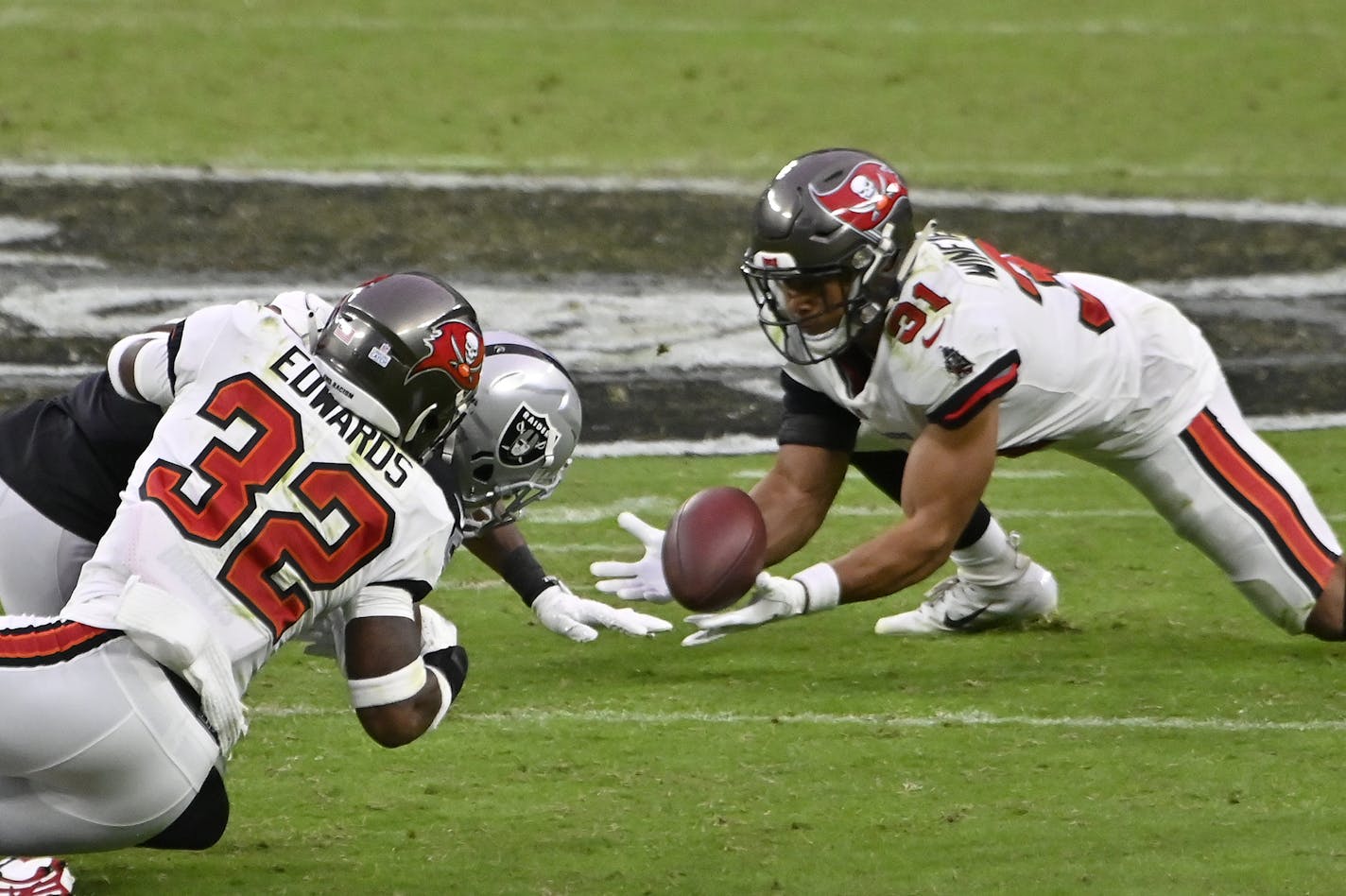 Tampa Bay Buccaneers strong safety Antoine Winfield Jr. (31) makes an interception against the Las Vegas Raiders during the second half of an NFL football game, Sunday, Oct. 25, 2020, in Las Vegas. (AP Photo/David Becker)