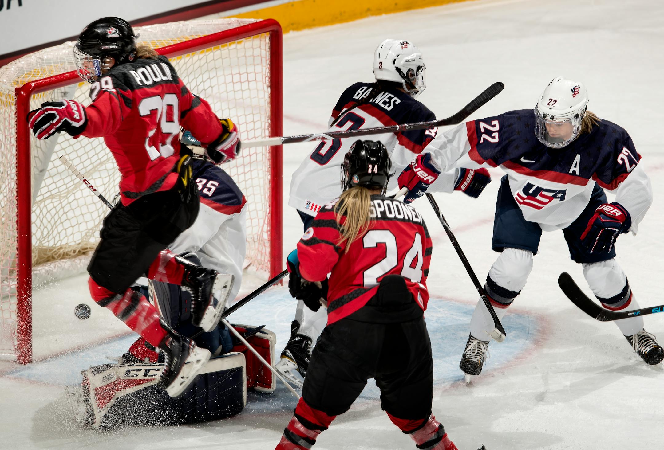 Canada's Marie Philip Poulin (29) shot the puck past USA goalie Maddie Rooney for a goal in the second period.