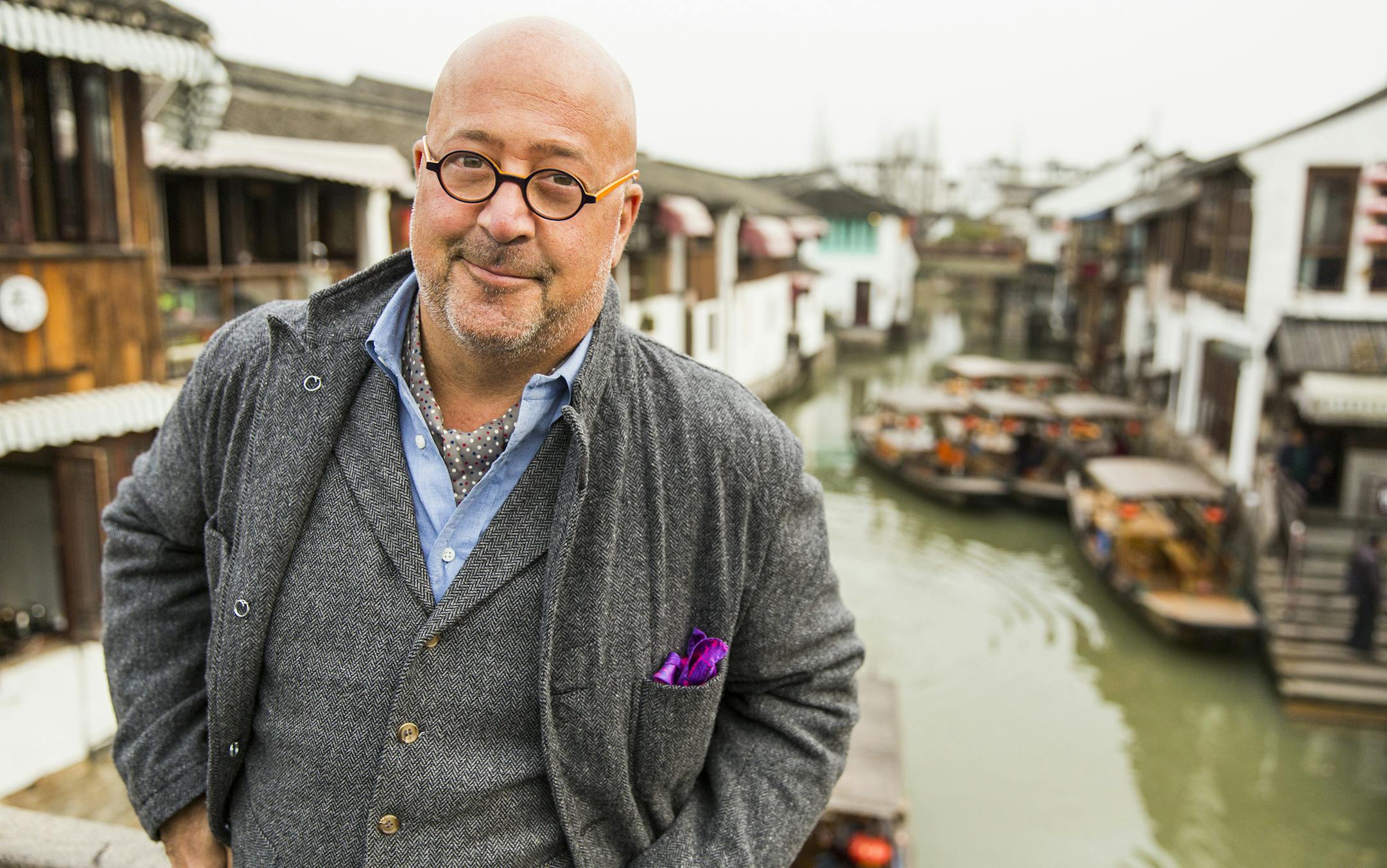 ZHUJIAJIAO, CHINA - MARCH 20: Host Andrew Zimmern poses for a portrait on a bridge in the ancient water town of Zhujiajiao in China. As seen on Travel Channel’s Bizarre Foods with Andrew Zimmern. David Hogsholt, Travel Channel