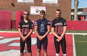 From 2018, here’s current Michigan quarterback J.J. McCarthy (center) with Gophers quarterback Athan Kaliakmanis on the right and his older brother,