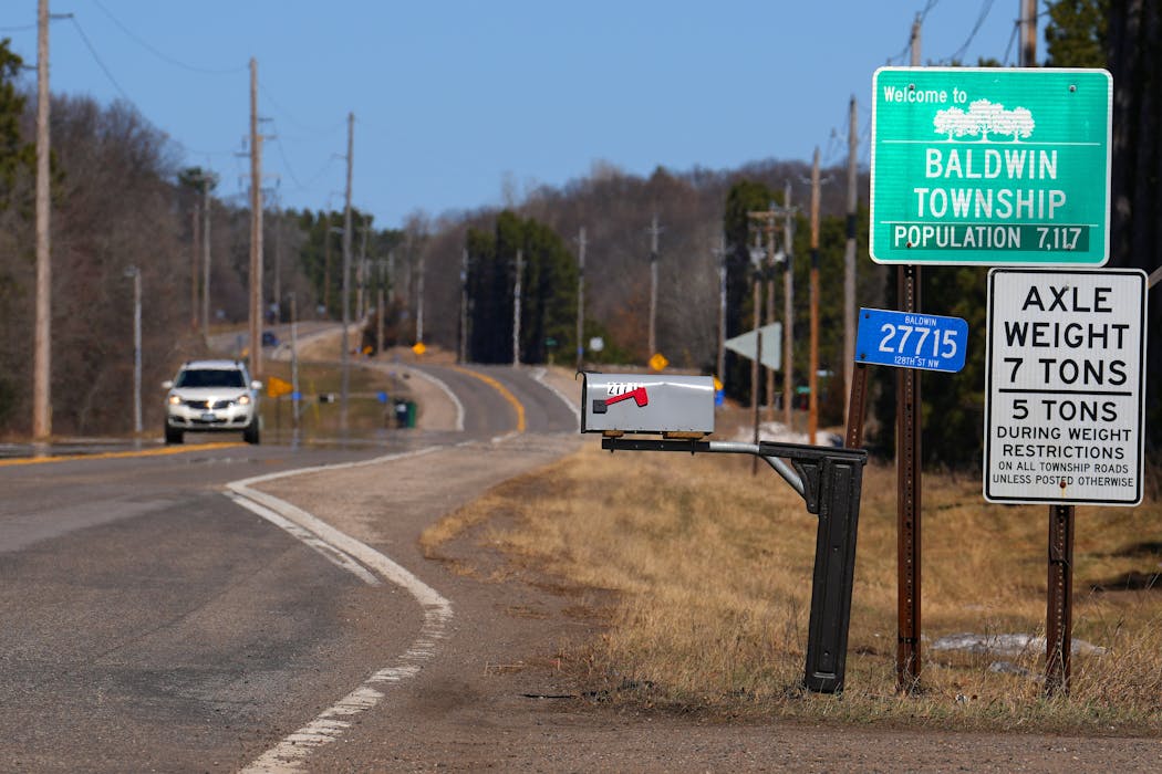 A sign on its southern border notes the population of Baldwin Township, Minn.