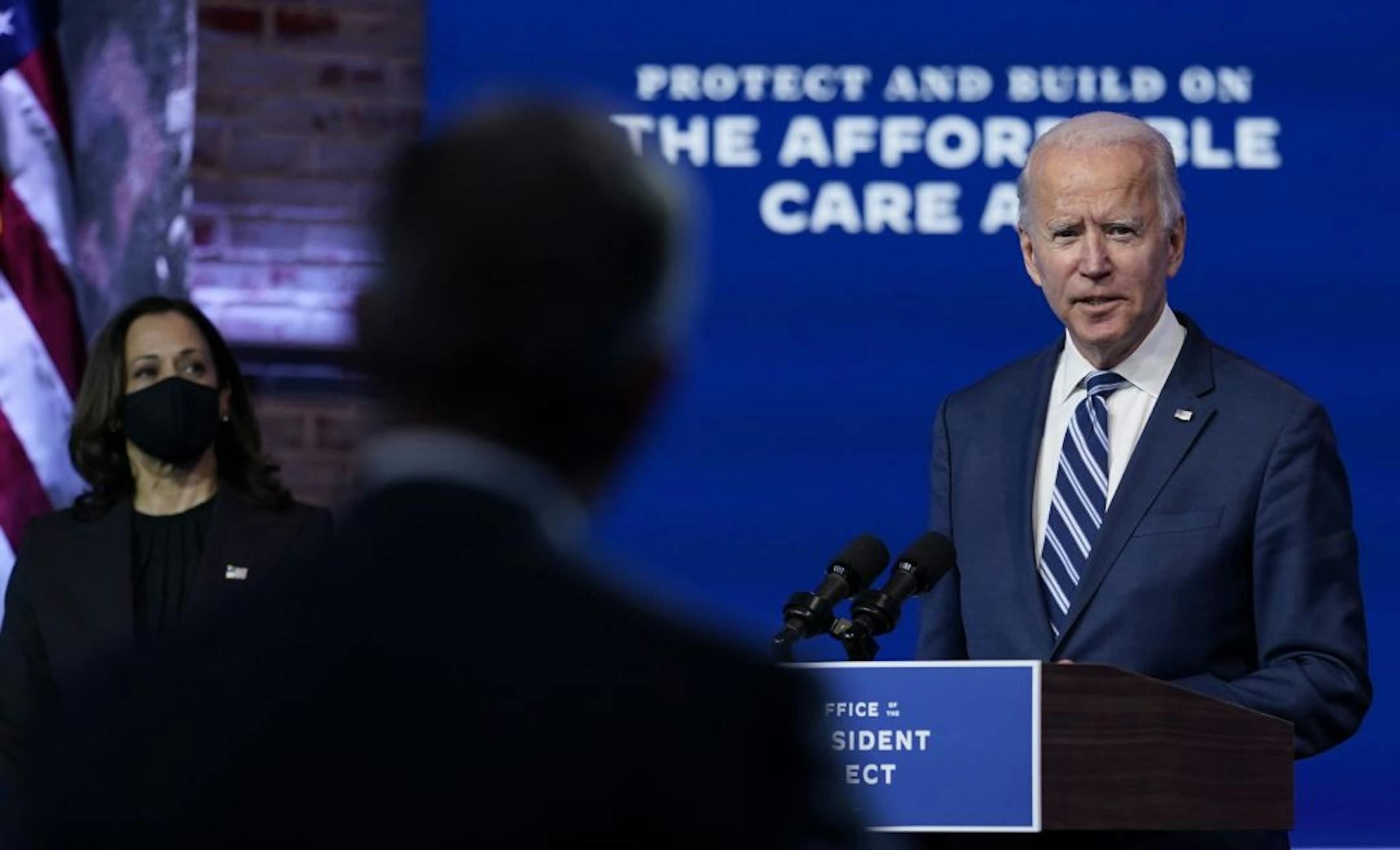 President-elect Joe Biden, joined by Vice President-elect Kamala Harris, answers a reporter's question at the Queen theater, Tuesday, Nov. 10, 2020, in Wilmington, Del.