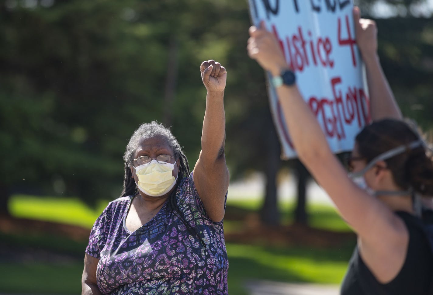 Kim Young, an elder from the Superior African Heritage Community, raised her fist in solidarity with protestors as they marhed outside the Douglas County Courthouse in Superior, WI on Thursday. ] ALEX KORMANN • alex.kormann@startribune.com Around 200 protestors gathered outside the Douglas County Courthouse in Superior, WI on Thursday June 4, 2020 to demand reform in the police and justice for all people of color, including George Floyd. Elders from the black and indigenous community spoke to th