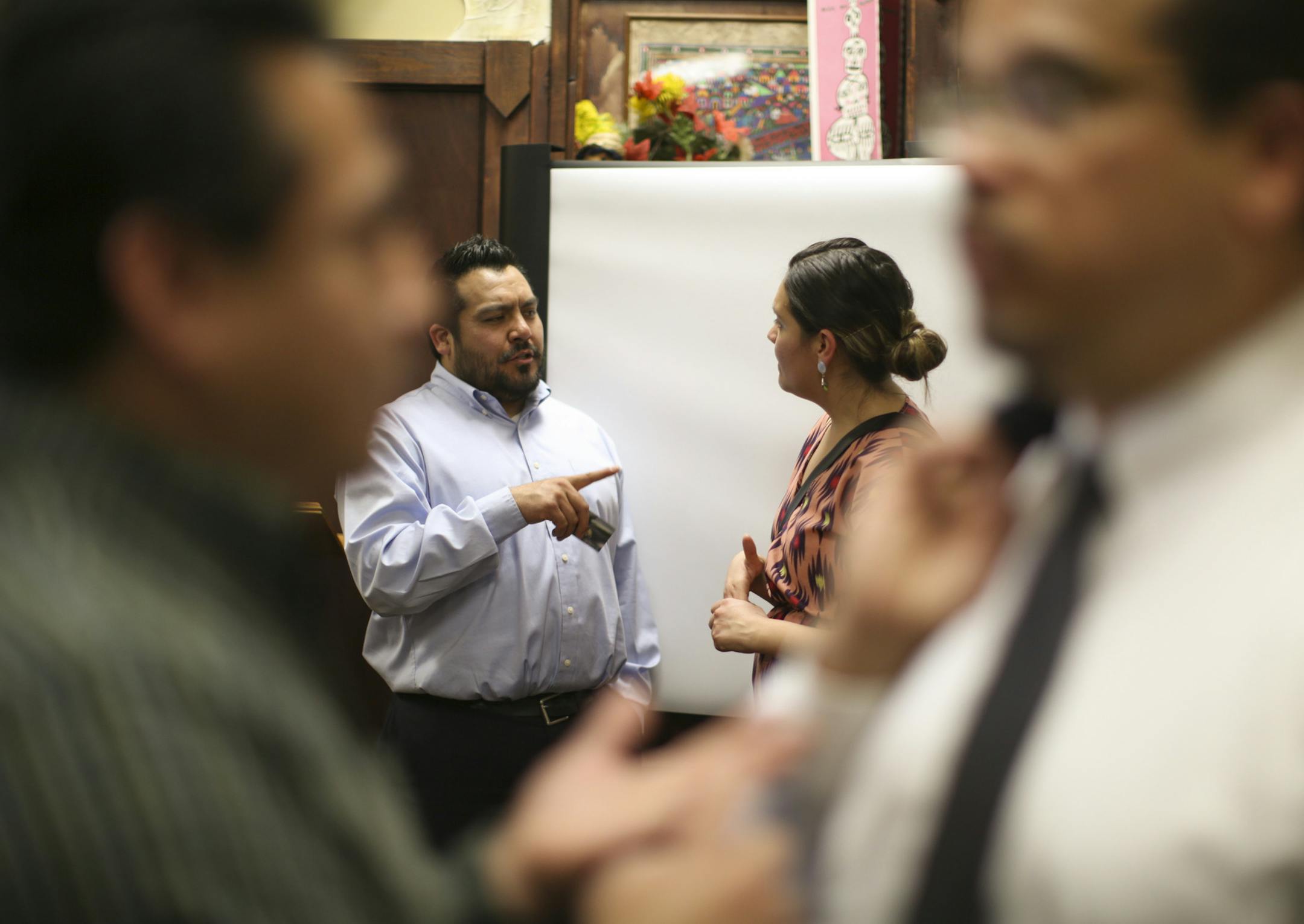 Felipe Illescas, program director for the A.R.E., visited with someone who attended the presentation Wednesday afternoon at Mercado Central. ] JEFF WHEELER &#xef; jeff.wheeler@startribune.com Pillsbury United Communities and the city of Minneapolis announced the Administrative Relief Engagement Project, a new support center Wednesday afternoon, April 1, 2015 where applicants for Obama's deportation reprieve programs will be able to get some help. Only problem: The programs are suspended, tied up
