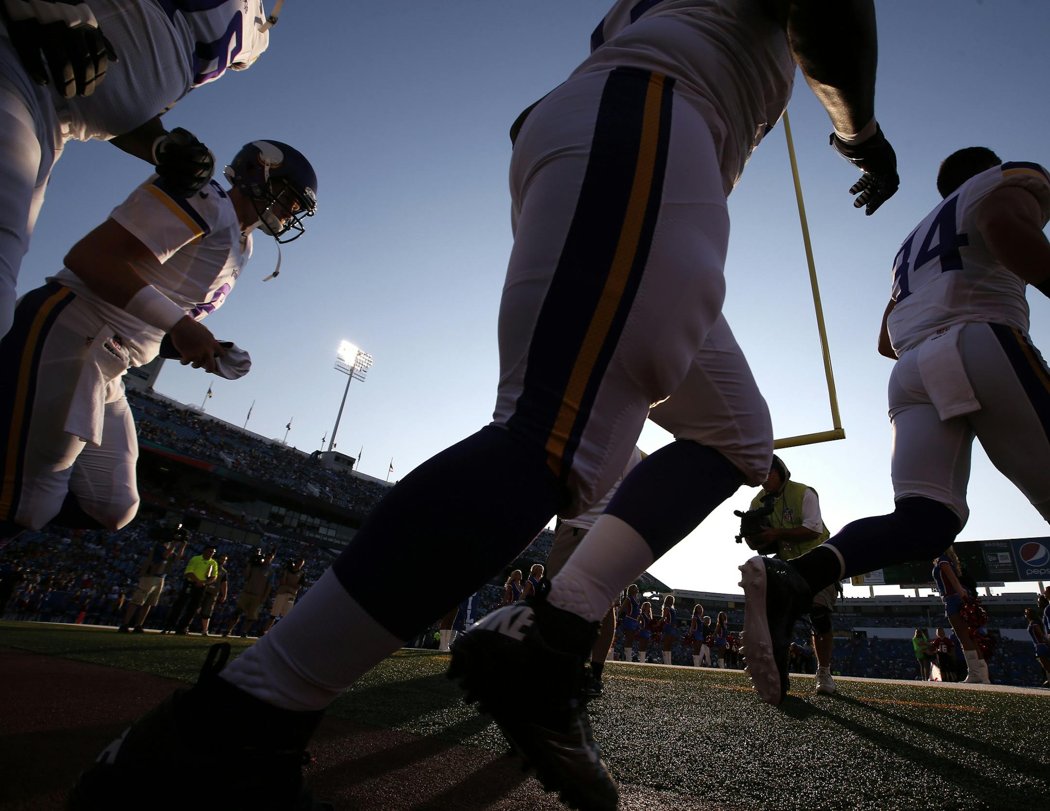 Minnesota Vikings players ran onto the field during team introductions. ] CARLOS GONZALEZ cgonzalez@startribune.com August 16, 2013, NFL Ralph Wilson Stadium, Orchard Park, NY Minnesota Vikings vs. Buffalo Bills