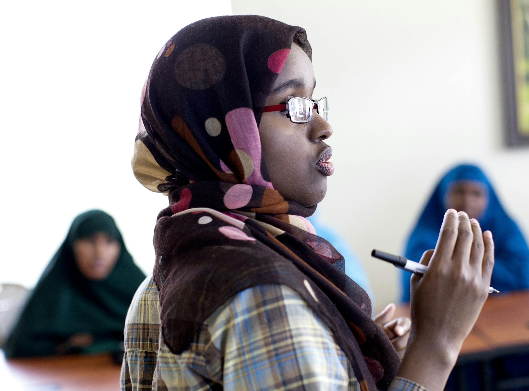 Family Reunification and Intern Coordinator Fartun M. Abdi leads a Cultural Orientation class for new Somali refugees at Lutheran Social Service of Minnesota in Minneapolis July 17, 2014. (Courtney Perry/Special to the Star Tribune)