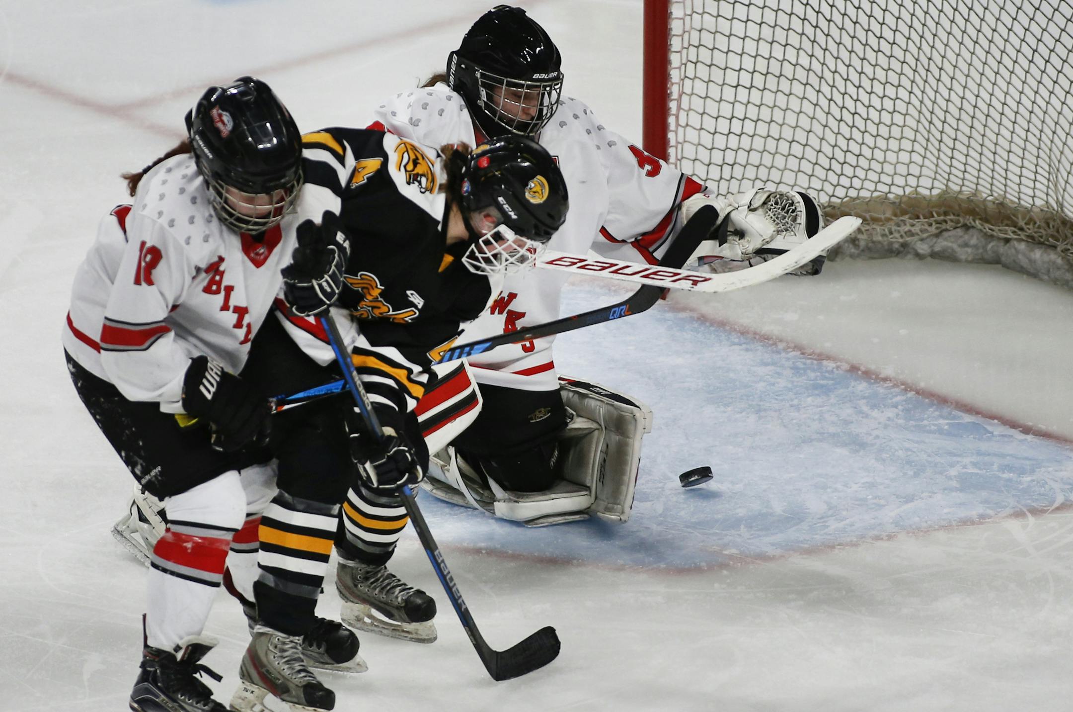 Mankato East's Evie Johnson (4) put the puck past Mound Westonka's goalie Taylor Smith in the third period. ] Shari L. Gross • shari.gross@startribune.com Mound Westonka defeated Mankato East 4-2 in a Class 1A quarterfinal game of the MSHSL hockey tournament on Wednesday, Feb. 20, 2019 at the Xcel Energy Center in St. Paul, Minn.