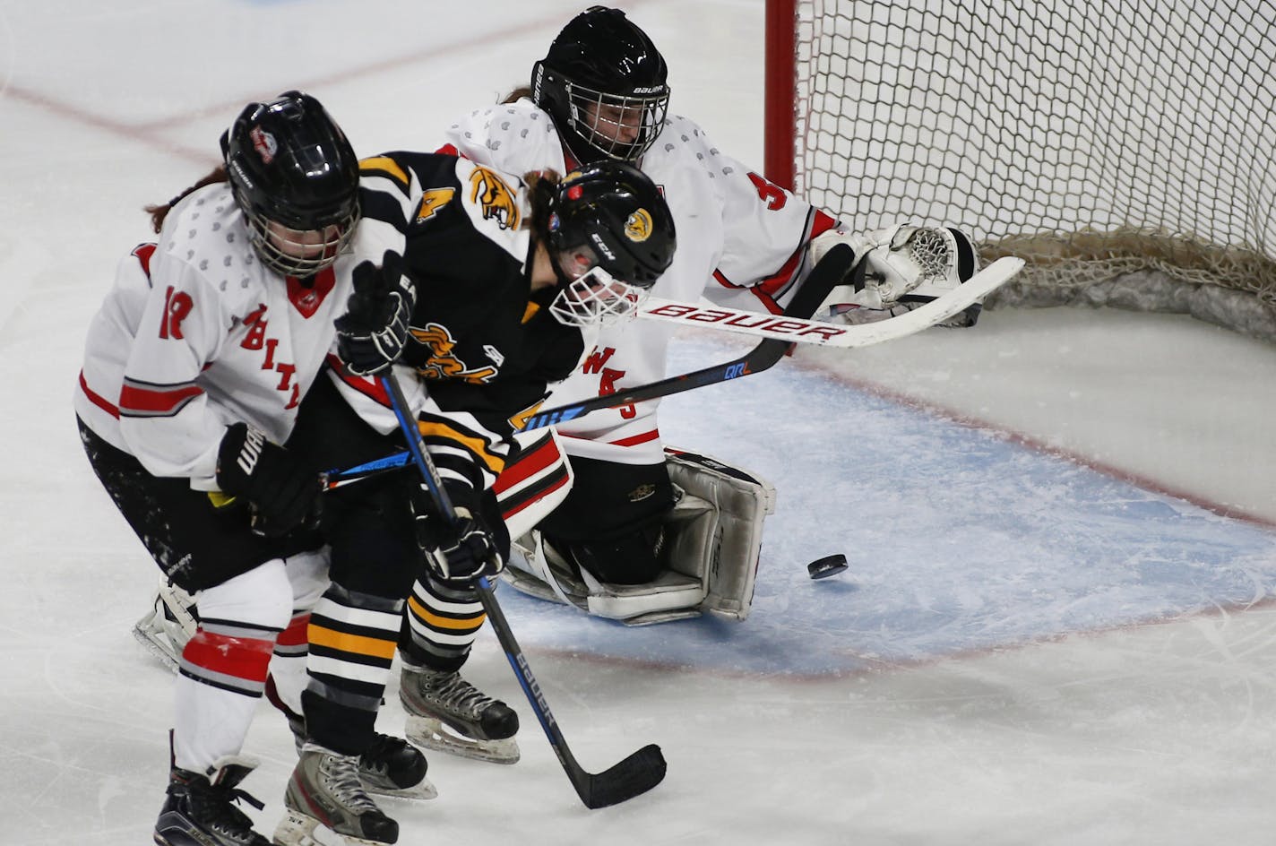 Mankato East's Evie Johnson (4) put the puck past Mound Westonka's goalie Taylor Smith in the third period. ] Shari L. Gross &#x2022; shari.gross@startribune.com Mound Westonka defeated Mankato East 4-2 in a Class 1A quarterfinal game of the MSHSL hockey tournament on Wednesday, Feb. 20, 2019 at the Xcel Energy Center in St. Paul, Minn.