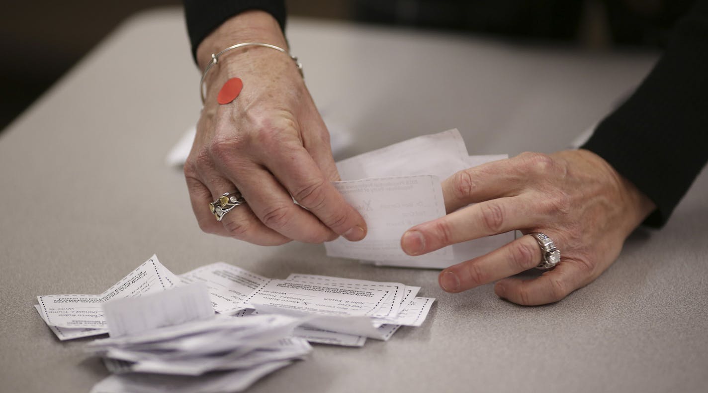 Counting the ballots for the Burnsville precinct 9 Republican caucus Tuesday night. Sen. Marco Rubio won with 40 votes, followed by Sen. Ted Cruz with 19, Donald Trump 17, Ben Carson 7, and John Kasich 3. ] JEFF WHEELER &#xef; jeff.wheeler@startribune.com Eagan and Burnsville residents gathered to attend their precinct caucuses at Black Hawk Middle School Tuesday evening, March 1, 2016. ORG XMIT: MIN1603012054533201