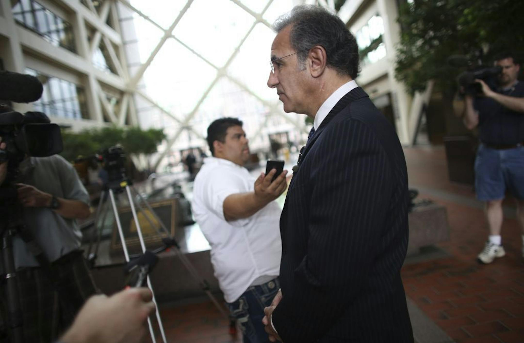 Attorney Steve Meshbesher, who represented Kao Xiong, talked about how sad the guilty verdict was for the family at the Hennepin County Government Center in Minneapolis Min., Friday, May 31, 2013. Xiong was found guilty of child endangerment after his son was accidentally shot with a loaded gun hidden in the bedroom.