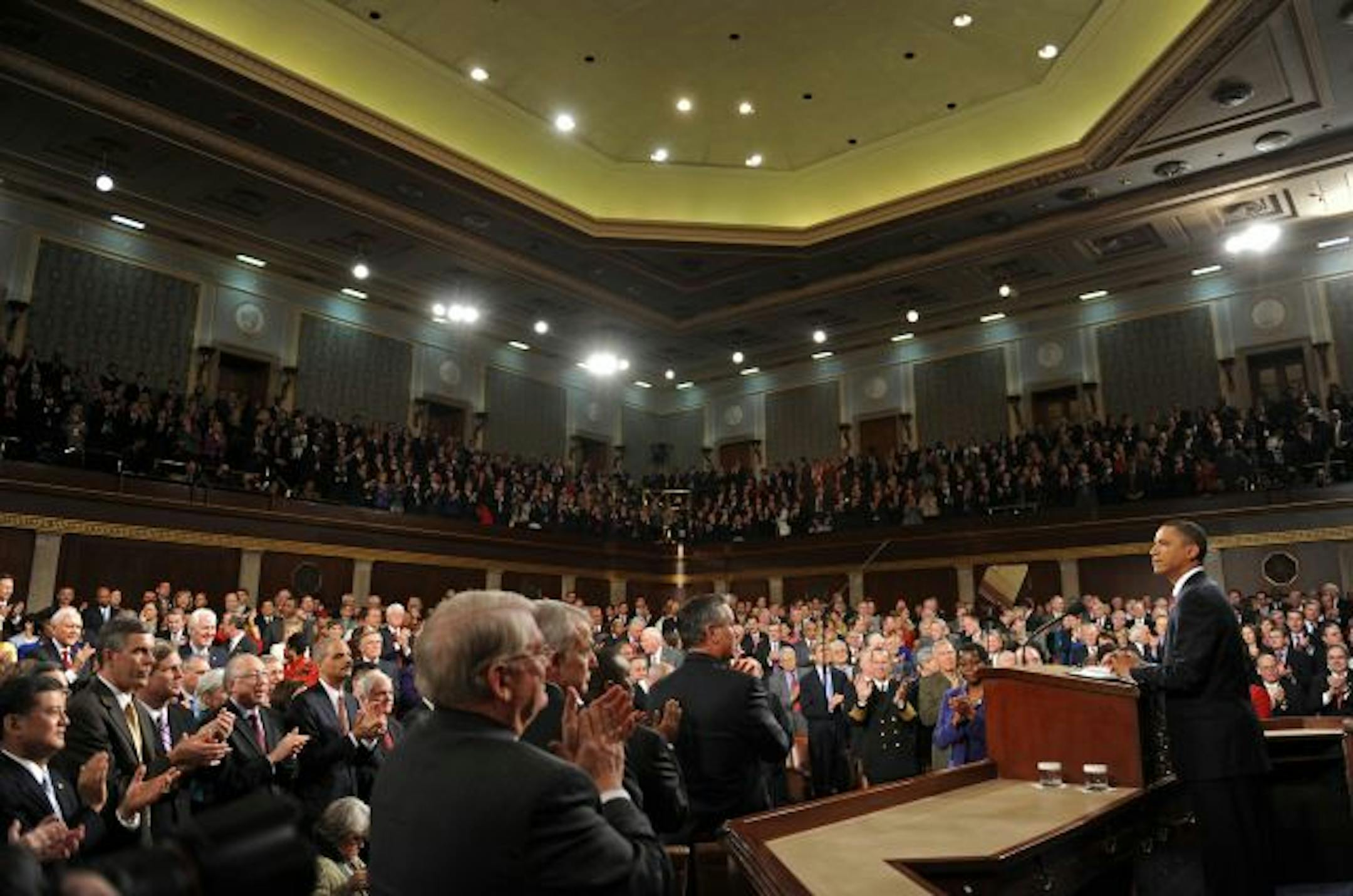 Members of Congress gave President Obama a standing ovation as he prepared to deliver his first State of the Union speech Wednesday.