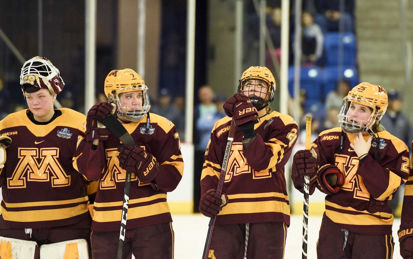 Minnesota players line up for the second-place awards after losing 2-0 to Wisconsin in the NCAA Division I women's Frozen Four hockey championship game, Sunday, March 24, 2019, in Hamden, Conn. (AP Photo/Stephen Dunn)