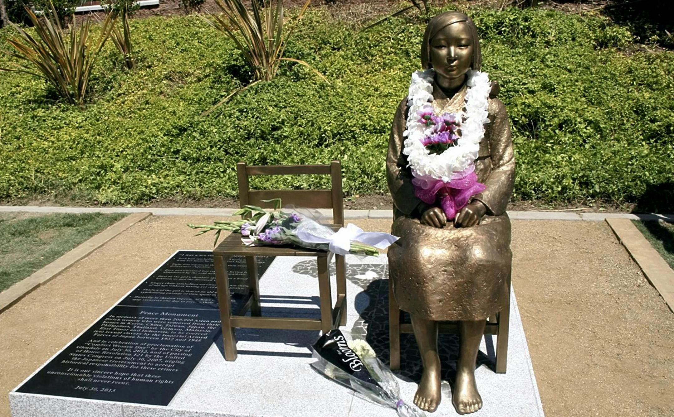 The bronze statue of ' comfort woman', a Korean girl is unveiled at Central Park in Glendale, Los Angeles on July 30, 2013. The statue is a replica in front of the Japanese Embassy in Seoul, South Korea. The Glendale city council approved the memorial as Japanese Americans had opposed to it. ( The Yomiuri Shimbun via AP Images ) ORG XMIT: YOMIU