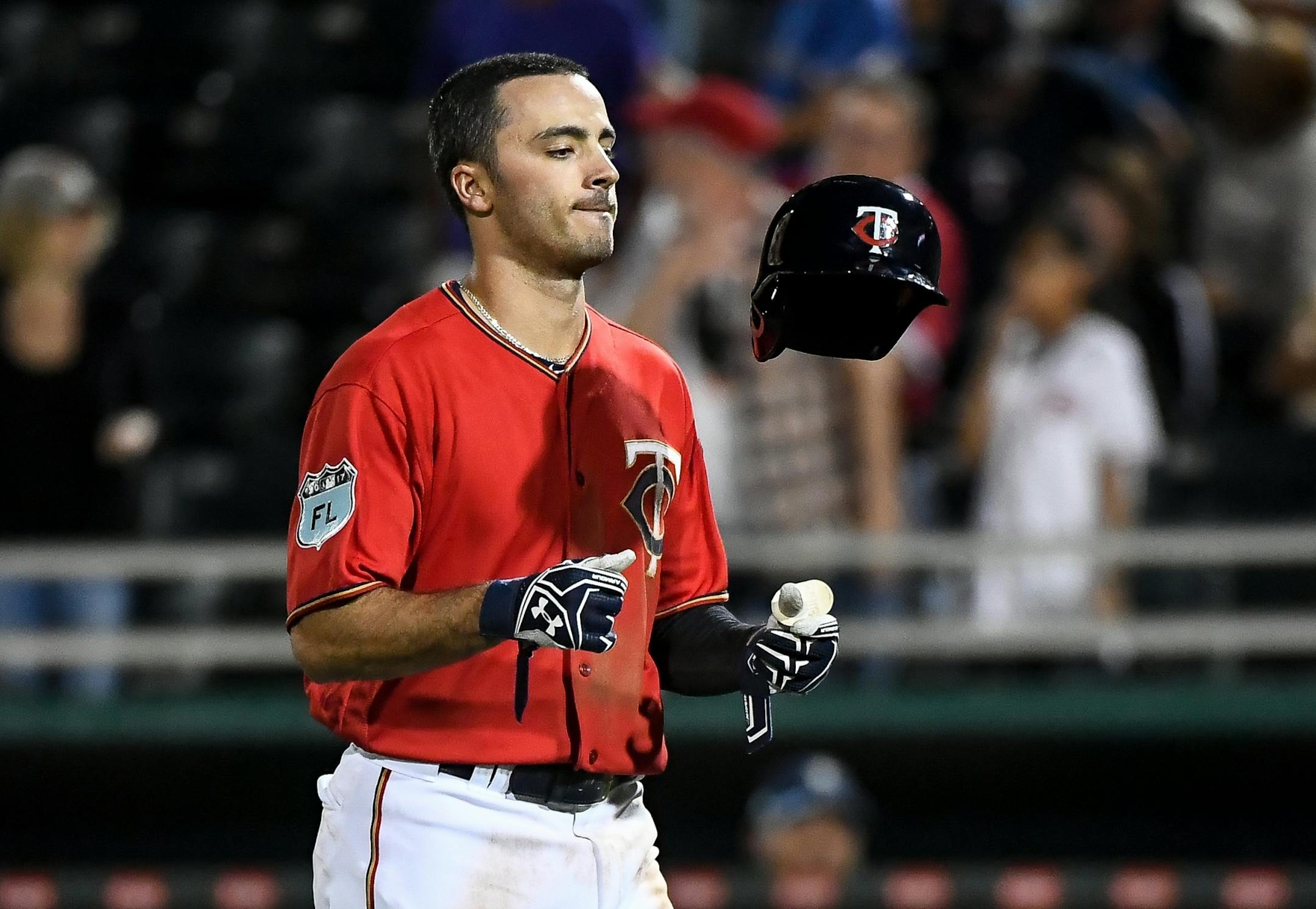 Minnesota outfielder Zack Granite flipped his helmet after grounding out to first in the bottom of the ninth inning, to end the inning and the game with one man on base.