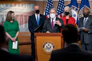 Speaker of the House Nancy Pelosi, D-Calif., left, is joined at a news conference by members of the Democratic Caucus, from left, Rep. Sean Patrick Ma