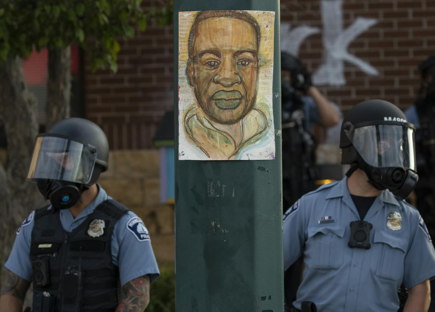 Police in riot gear stood guard on May 27 at the Third Police Precinct station, which was later badly damaged by during protests.