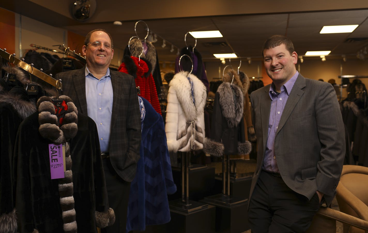 Bill Ribnick, left, with his son, Justin, in the Ribnick Luxury Outerwear showroom Thursday afternoon. ] JEFF WHEELER &#x2022; jeff.wheeler@startribune.com Ribnick Luxury Outerwear, nearly a century old and the North Loop's senior retailer, started as an animal-pelt wholesale operation by Isaac Ribnick, a Latvian immigrant. Four generations later it's still thriving under the leadership of Bill Ribnick, left, and his son, Justin. They were photographed in the shop Thursday afternoon, December 29