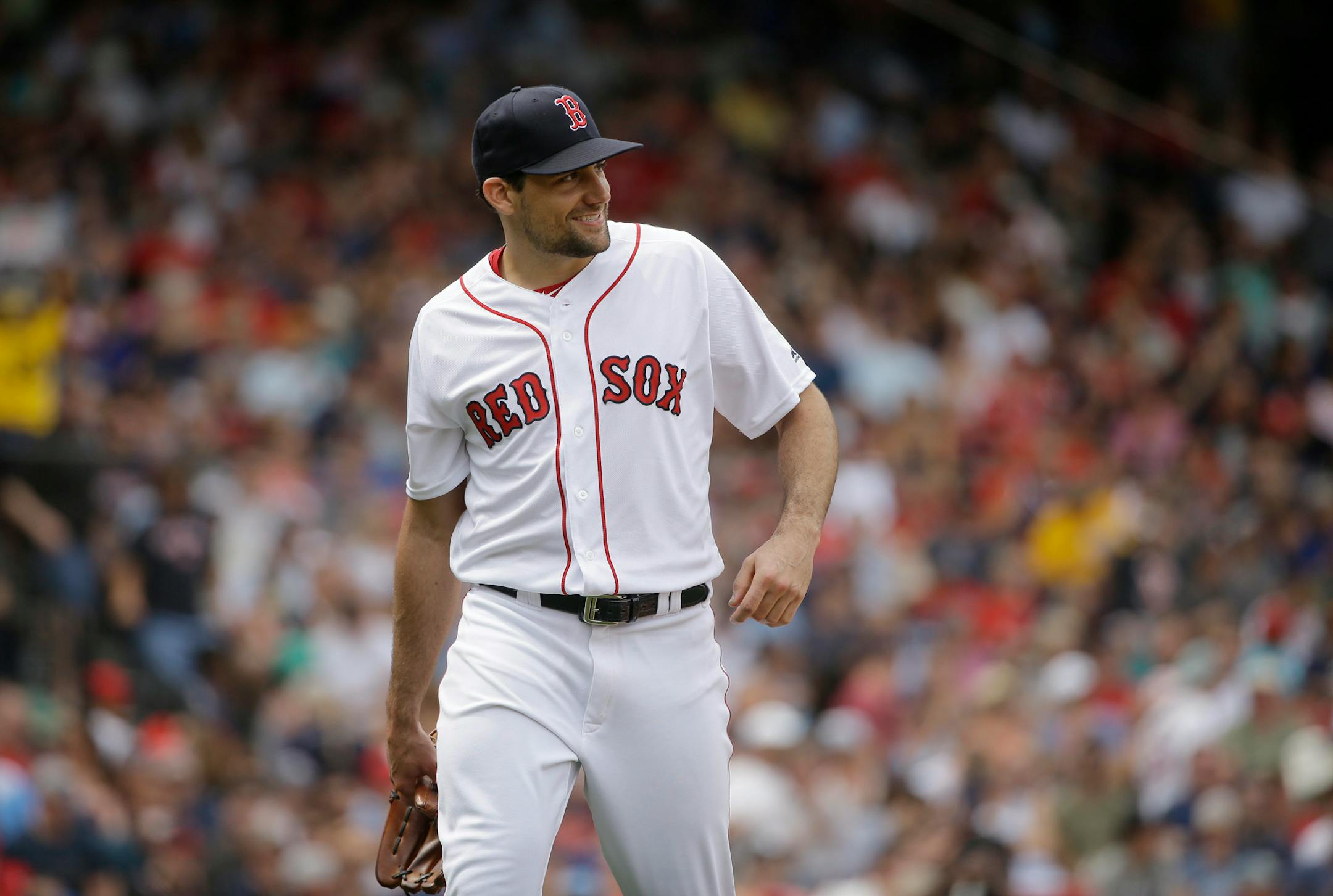 Boston Red Sox's Nathan Eovaldi smiles as he steps off the mound after pitching against the Minnesota Twins in the fourth inning of a baseball game, Sunday, July 29, 2018, in Boston. (AP Photo/Steven Senne)