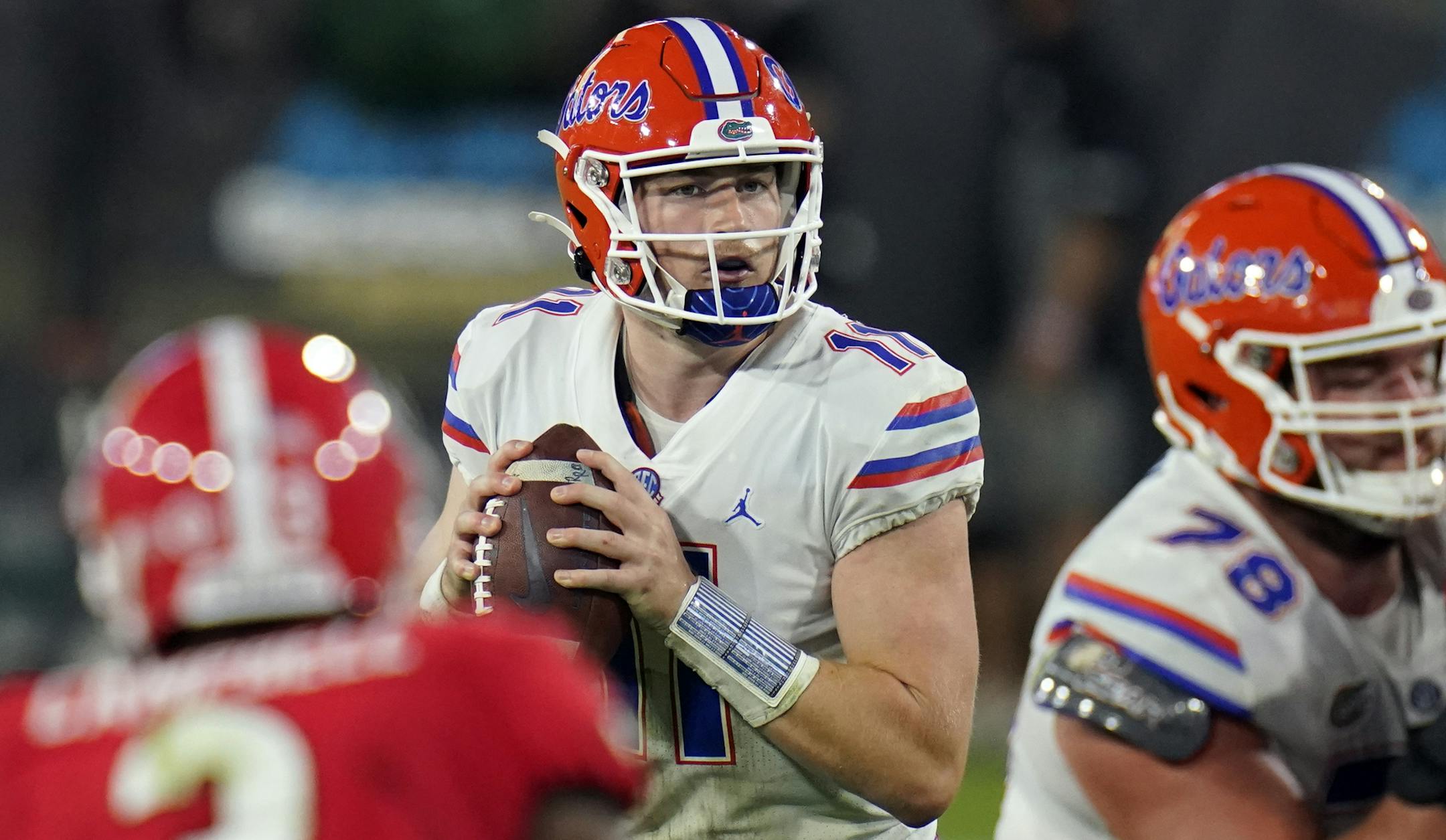 Florida quarterback Kyle Trask (11) looks for a receiver during the second half of the team's NCAA college football game against Georgia, Saturday, Nov. 7, 2020, in Jacksonville, Fla. (AP Photo/John Raoux)