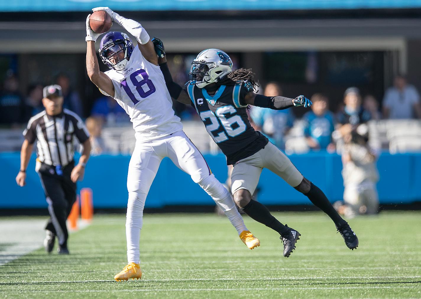 Vikings wide receiver Justin Jefferson (18) made a grab defended by Panthers cornerback Donte Jackson (26) during the fourth quarter, Sunday, October 17, 2021 in Charlotte, NC. ] ELIZABETH FLORES • liz.flores@startribune.com