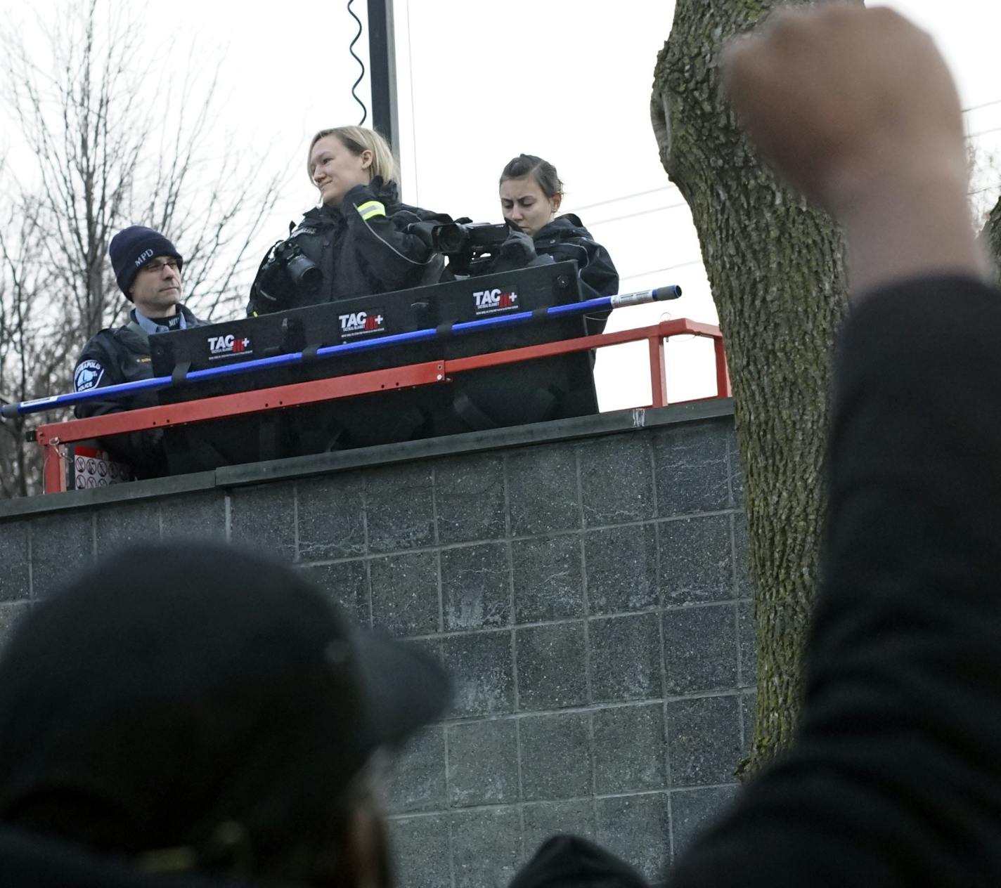 At the 4th Precinct in North Minneapolis, police recorded protesters who continued to demand answers over the death of Jamar Clark who was shot and killed by police .]Richard Tsong-Taatarii/rtsong-taatarii@startribune.com