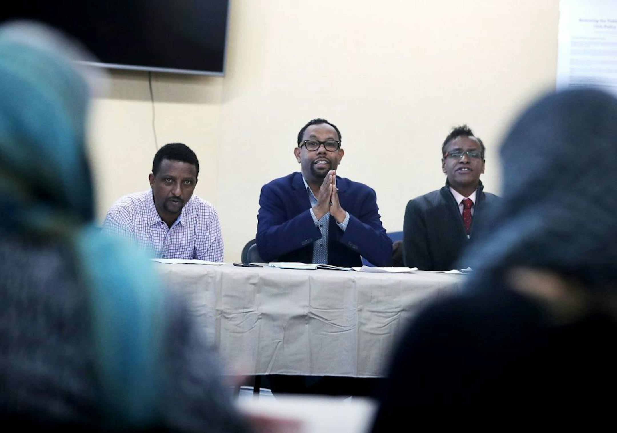 Family members of those killed in the fire sat down with Dar Al-Hijrah Mosque leaders, community leaders and volunteers and representatives of People's Center and Red Cross to discuss funds raised and help needed. Here, Ali Isse, staff member for U.S. Rep. Ilhan Omar, left to right, Wali Dirie executive director of Dar Al-Hijrah Mosque and Abdirizak Bihi, community organizer addressed those gathered Thursday, Dec. 5, 2019, at Dar Al-Hijrah Mosque in Minneapolis, MN.