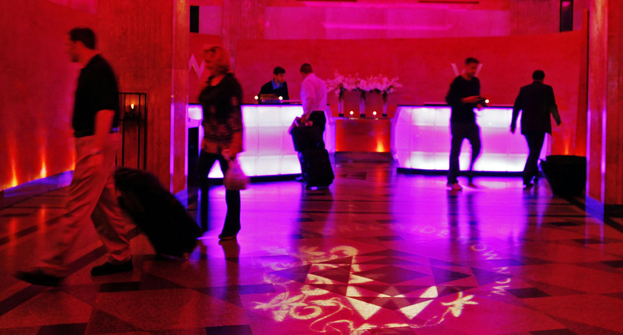 DAVID JOLES • djoles@startribune.com - Minneapolis, MN - Sept 3, 2010- The W Minneapolis Hotel, like many local and state hospitality businesses, has seen an uptick in activity recently, while other sectors of the economy have continued to slump. The posh W Minneapolis, located in the Foshay Tower, once the Midwest' tallest building, boasts 29 floors and 229 hotel rooms. In this photo:] Guests and travelers move through the hotel's lobby.