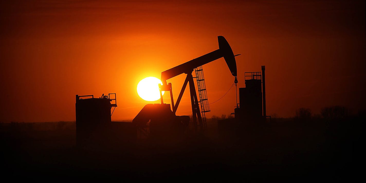 The sun set over the Bakken Oil Formation, behind an oil well near Williston. ] (JIM GEHRZ/STAR TRIBUNE) / September 26, 2013, Watford City, ND &#xe2;&#x20ac;&#x201c; BACKGROUND INFORMATION- PHOTOS FOR USE IN FIRST PART OF NORTH DAKOTA OIL BOOM PROJECT: Dozens of drilling rigs dot the North Dakota landscape in the Williston Basin and the Bakken Oil Formation. Once the rigs drill holes, several miles deep and then several miles horizontally, hydraulic fracturing technology (&#xe2;&#x20ac;&#x153;f