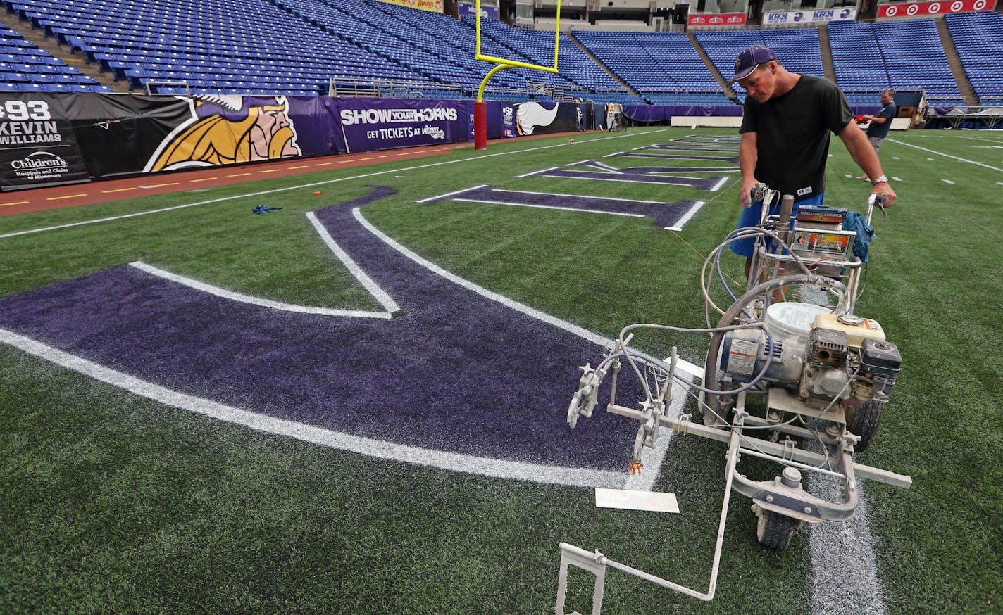 Wayne Enger of the Metrodome grounds crew outlined the Vikings endzone letters with a spray painter, during the first painting of the field in the final season of the Vikings at the stadium. Enger is from Big Lake and was photographed on 8/6/13.] Bruce Bisping/Star Tribune bbisping@startribune.com Wayne Enger/source.