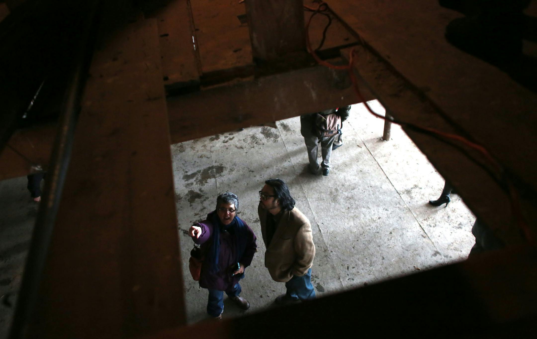 Filmmaker Angela Andrist, left, and Hai Truong, owner of Ngon Bistro, chatted as they looked around the old Victoria Theater in St. Paul.