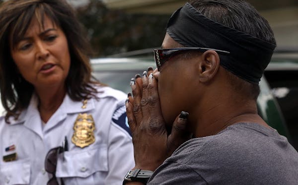 July 8, 2014: Chaujunha Dunigan talked to Minneapolis Police Chief Harteau about violence in her neighborhood.
