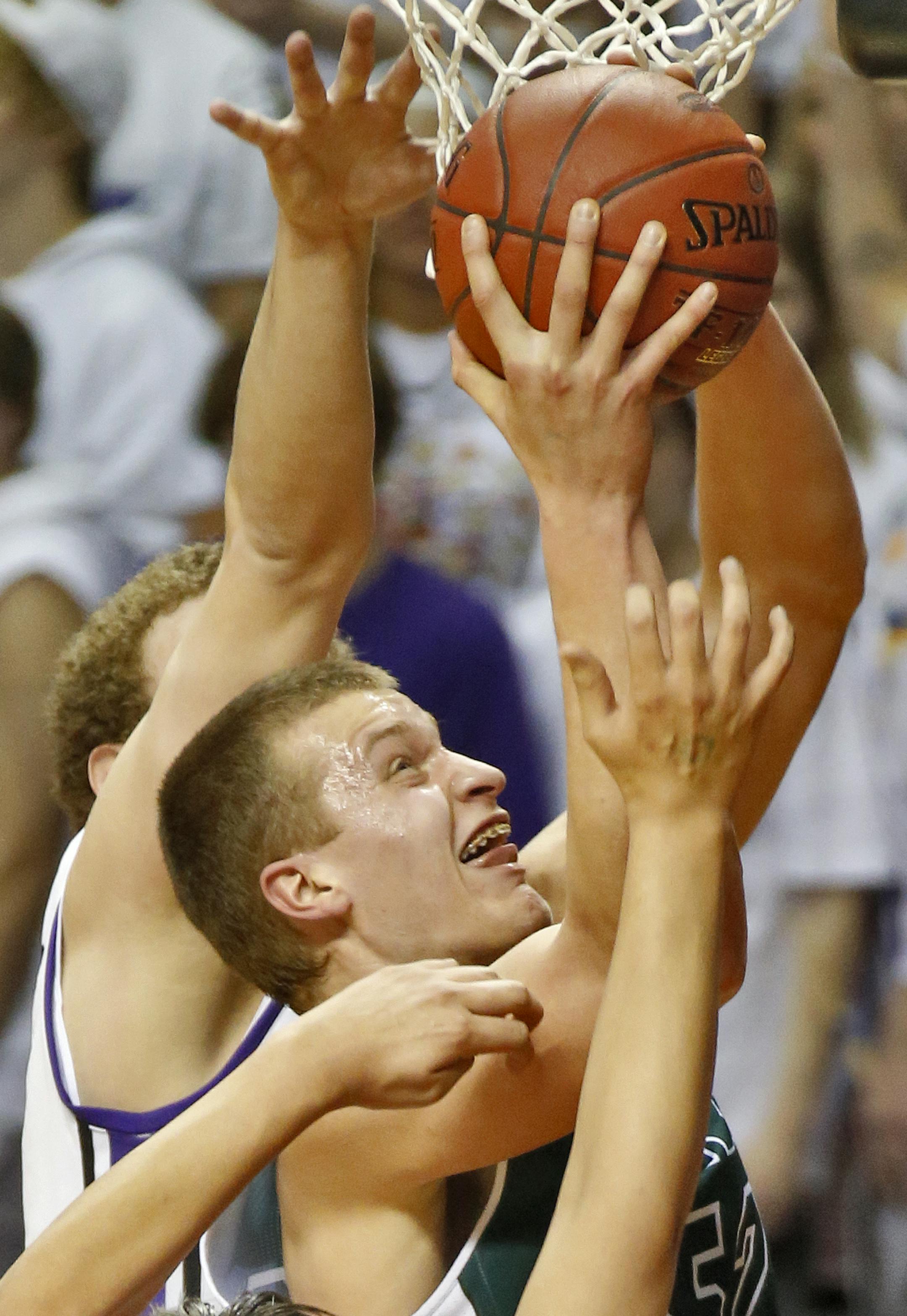 Holy Family'sJustin Dahl (52) had his shot contested by the Cloquet defense. ] Boys Basketball State Tournament. Class 3A Cloquet vs. Holy Family Catholic (MARLIN LEVISON/STARTRIBUNE(mlevison@startribune.com)