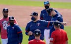 Twins manager Rocco Baldelli talks to players before a spring training game against the Braves on March 22 in Fort Myers