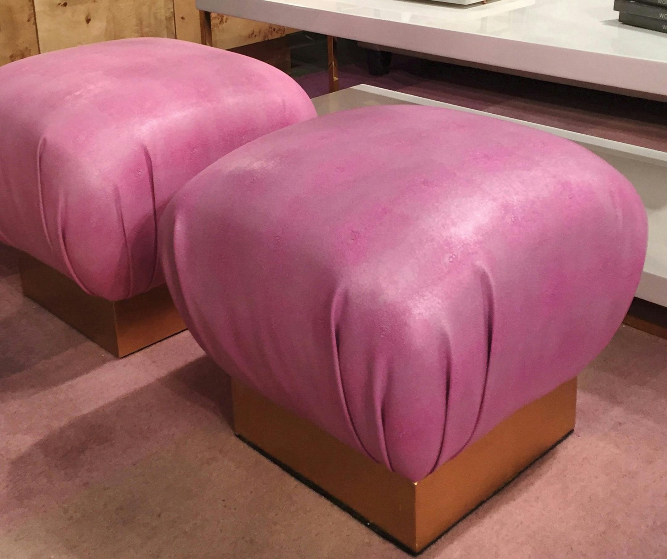 Faux shagreen pink poufs with brass bases by Worlds Away. (Patricia Sheridan/Pittsburgh Post-Gazette/TNS) ORG XMIT: 1204080