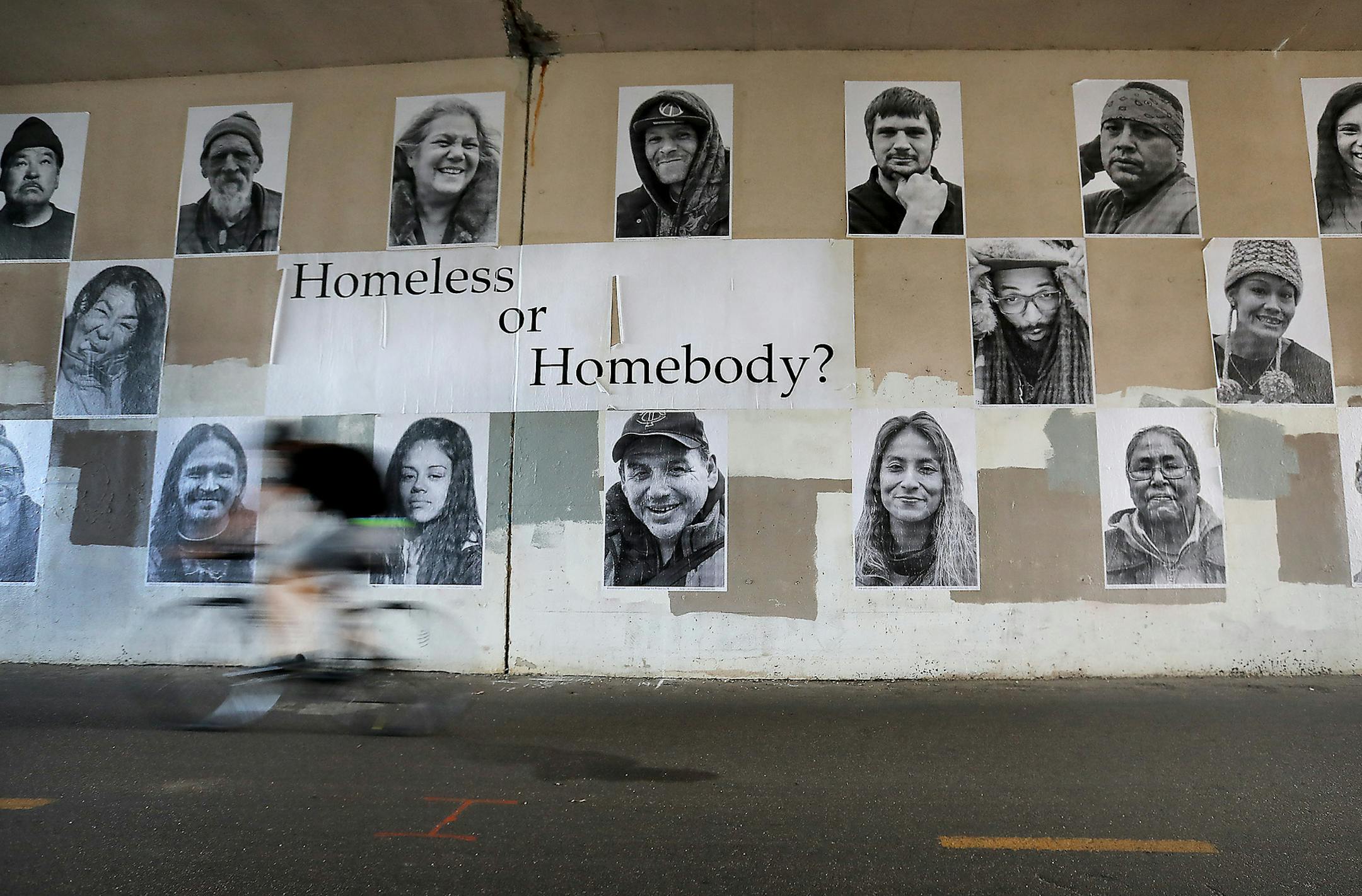 "Homeless or Homebody?" is a pop-up exhibit of 54 portraits, pasted to a wall under Hennepin Avenue S. in Uptown, showing people from the Hiawatha homeless encampment last year.