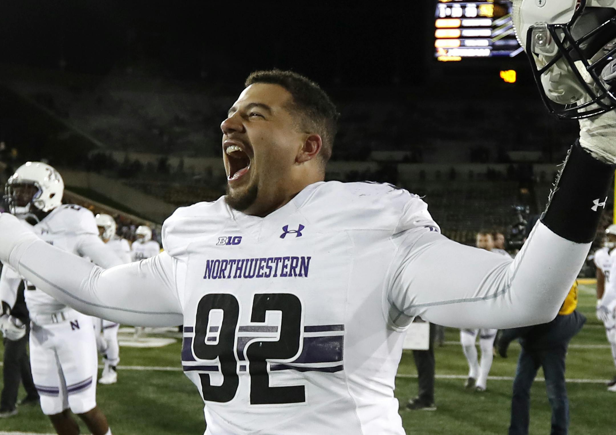 Northwestern defensive lineman Fred Wyatt celebrates after an NCAA college football game against Iowa, Saturday, Nov. 10, 2018, in Iowa City, Iowa. Northwestern won 14-10. (AP Photo/Charlie Neibergall)
