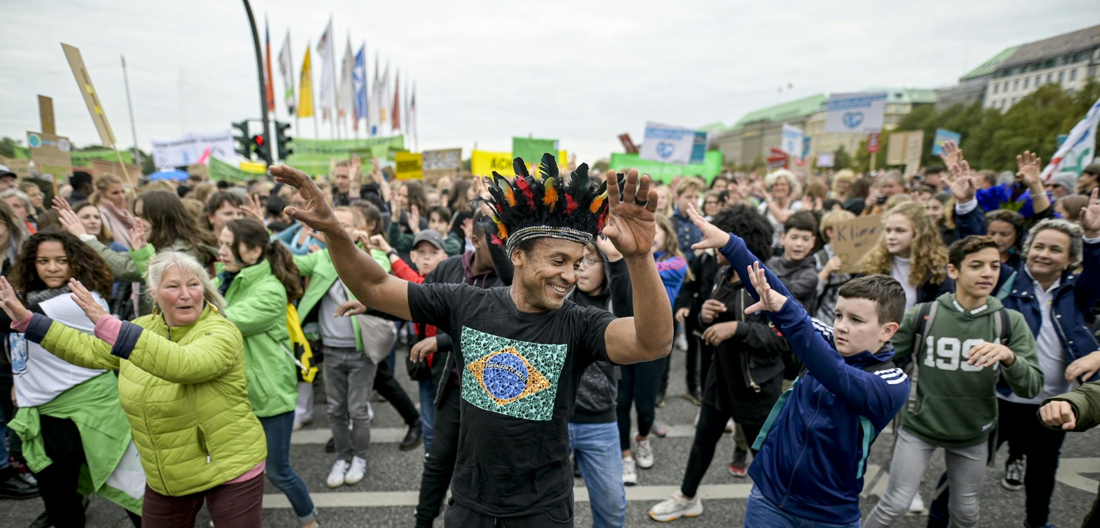 People attend a 'Fridays For Future' rally in Hamburg, Germany, Friday, Sept. 20, 2019. Protests of the 'Fridays For Futurte' movement against the increase of carbon dioxide emissions are planned Friday in cities around the globe. In the United States more than 800 events were planned Friday, while in Germany more than 400 rallies are expected.