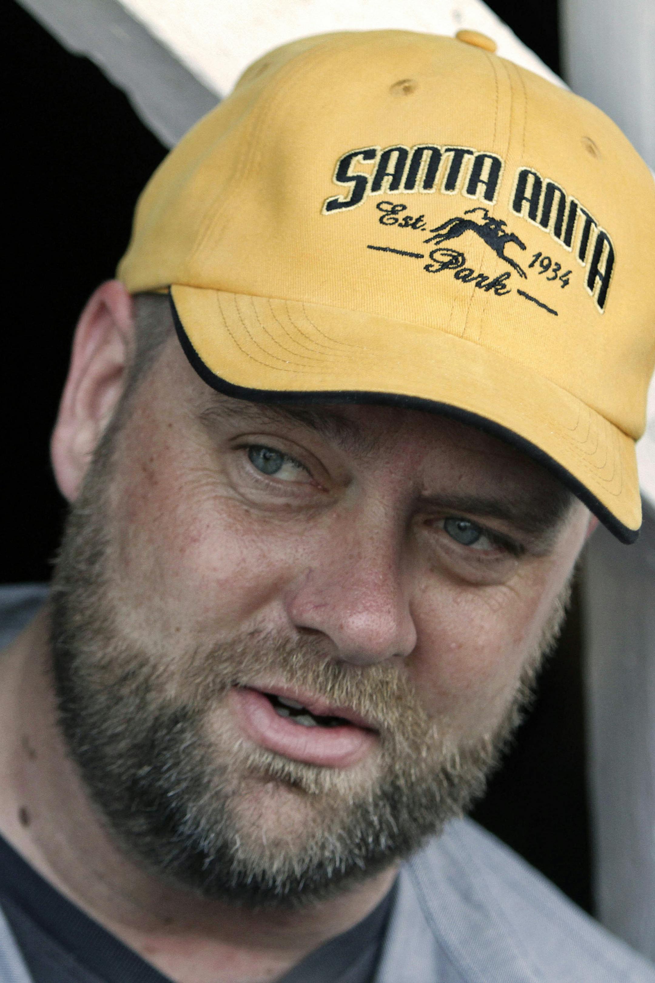 FILE- In this May 6, 2012, file photo, Kentucky Derby winning trainer Doug O'Neill talks about I'll Have Another's win at Churchill Downs in Louisville, Ky. O'Neill is gearing up for a Kentucky Derby repeat. A year after winning the Derby with I'll Have Another, the trainer is going for another _ this time with Goldencents. (AP Photo/Garry Jones, File) ORG XMIT: MIN2013043020021209