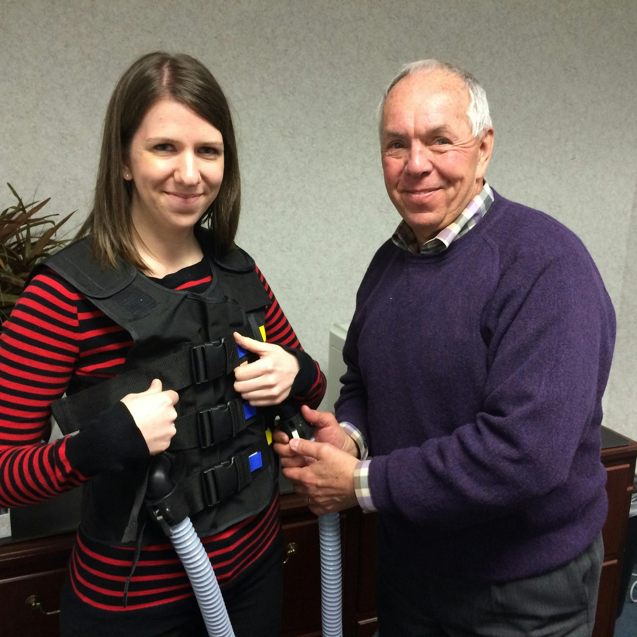 RespirTech Outcomes Program Coordinator Sarah Daignault and CEO Dr. Jim Ehlen demonstrate the "InCourage" airwary clearance therapy system.