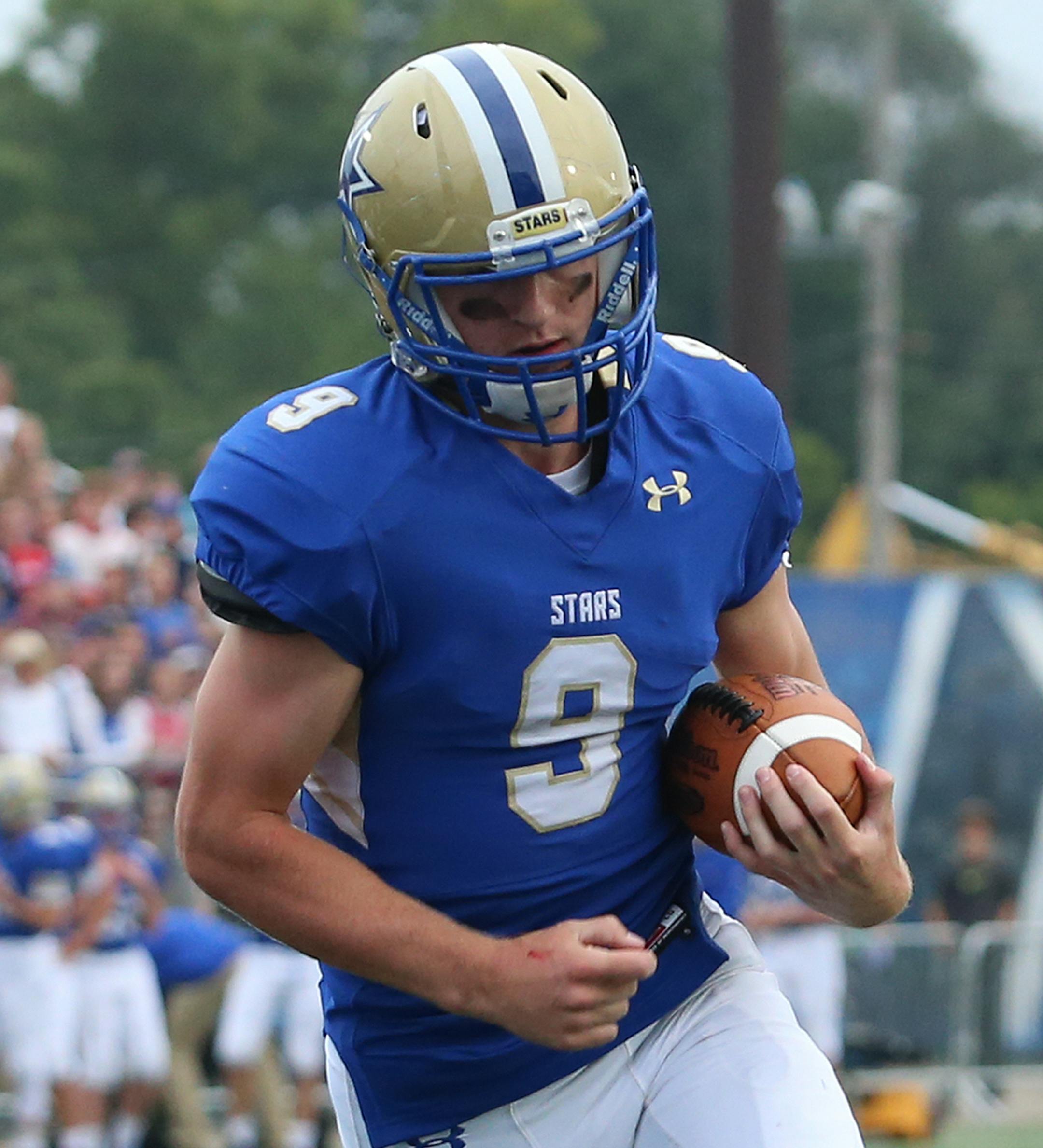 Quarterback Joseph Heimbold cruises into the end zone to score Holy Angels' first touchdown early in the first quarter on a three yard run. The Stars defeated the Pioneers 47-6 on Friday night. Photo by Cheryl Myers, SportsEngine