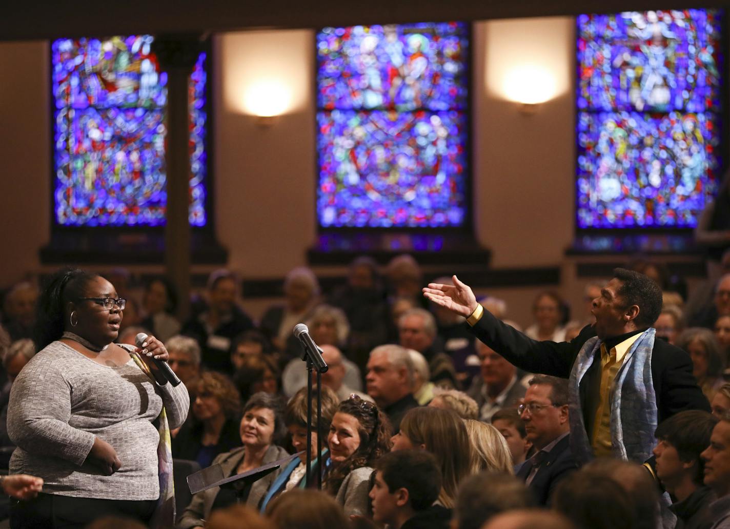 With J.D. Steele conducting at right, Becky Bratton soloed with the Mill City Singers choir during the Bold Hope in the North program Sunday afternoon.