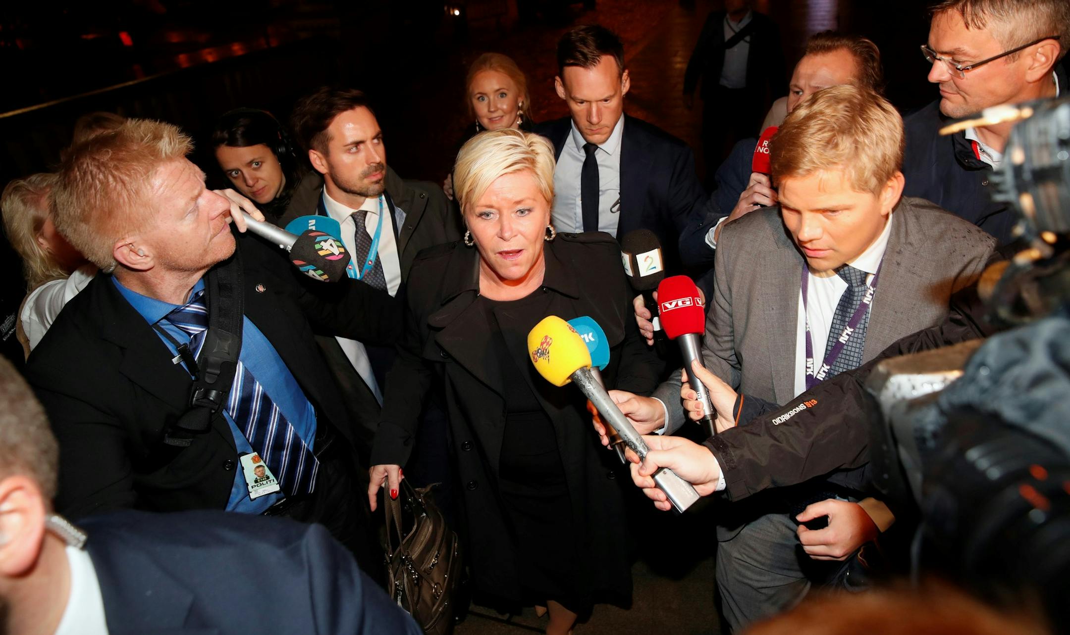 Leader of the Progress Party, Siv Jensen, centre, leaves the election vigil and walks to the the parliament building in Oslo, Monday evening, Sept. 11, 2017. The Norwegian Directorate of Elections said that with 51 percent of ballots counted, the Conservatives of Prime Minister Erna Solberg and coalition partner the Progress Party were projected to win a total 74 seats in the 169-seat Storting. (Cornelius Poppe/NTB scanpix via AP) ORG XMIT: LON837