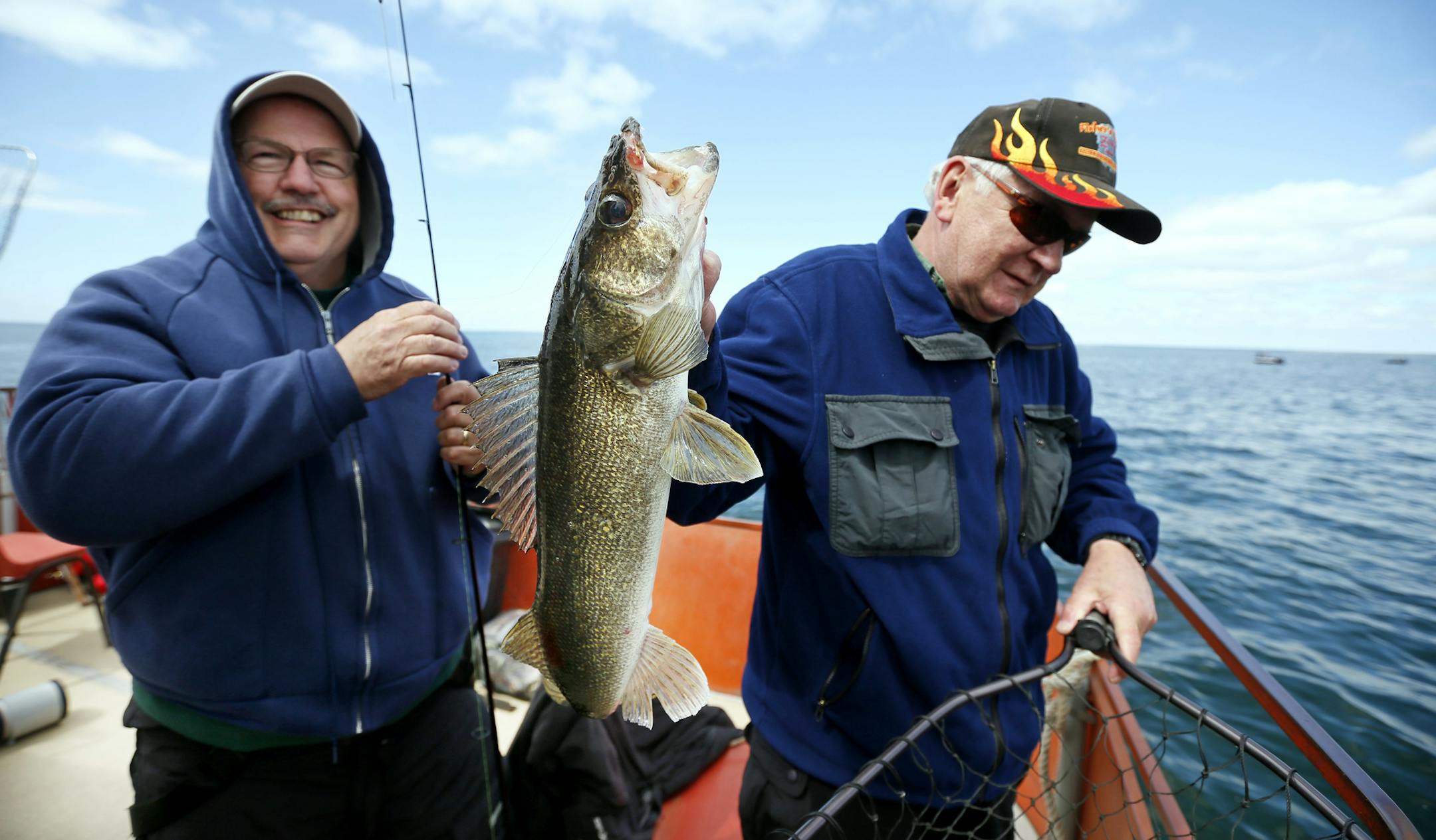 Dennis Schaeppi 61, of Stillwater pulled in a 25 1/2 inch walleye as Randy Zahradka netted the fish on Minnesota fishing opener at Lake Mille Lacs Saturday May 9, 2015 Malmo, MN. Randy is the boat captain for Fishers Resort.] For the first time in the history of the lake anglers are allowed a one-fish bag limit. Jerry Holt/ Jerry.Holt@Startribune.com ORG XMIT: MIN1505091417140106