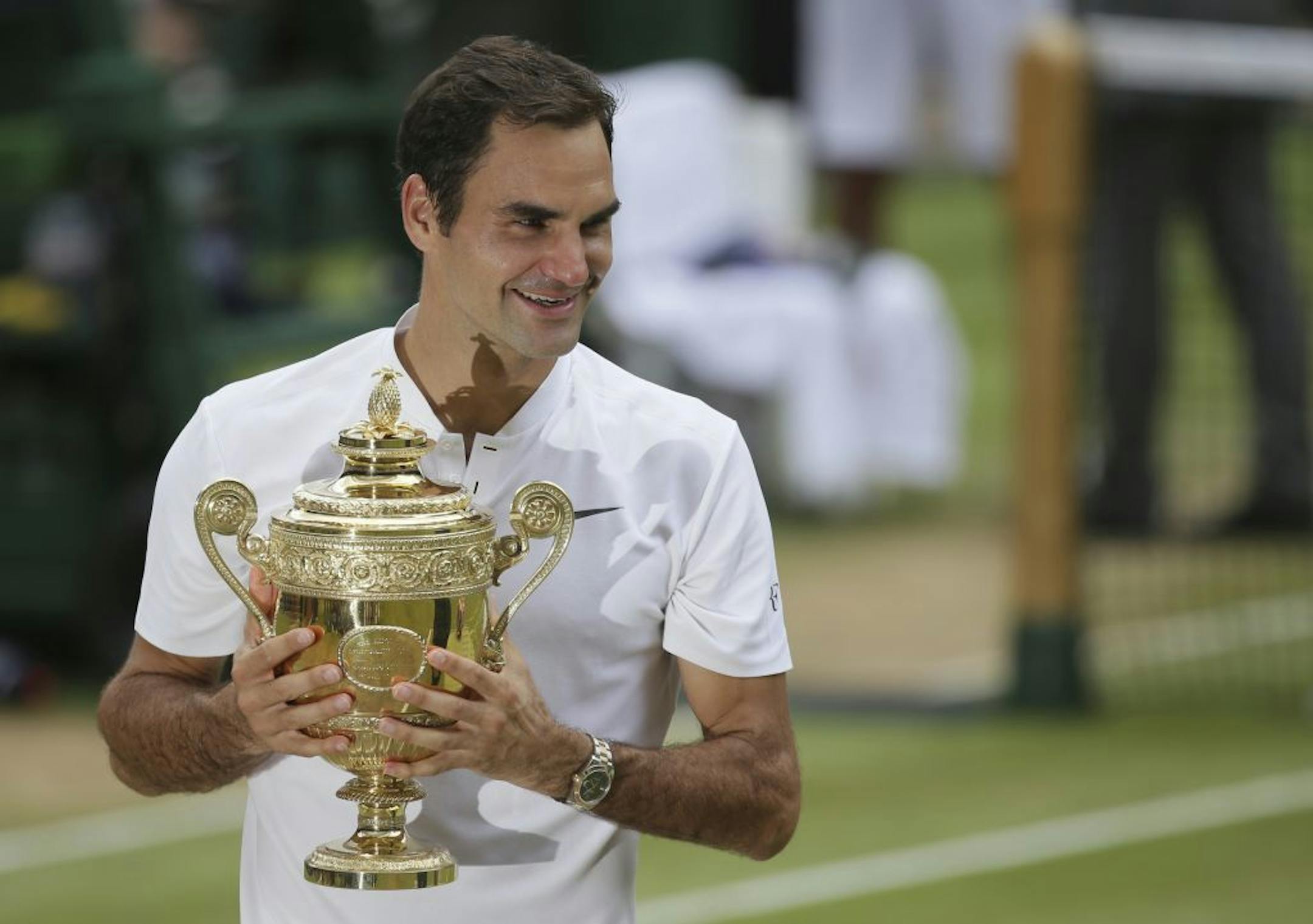 Switzerland's Roger Federer held the trophy after defeating Croatia's Marin Cilic to win the men's singles final at Wimbledon. He's the favorite to win the U.S. Open.