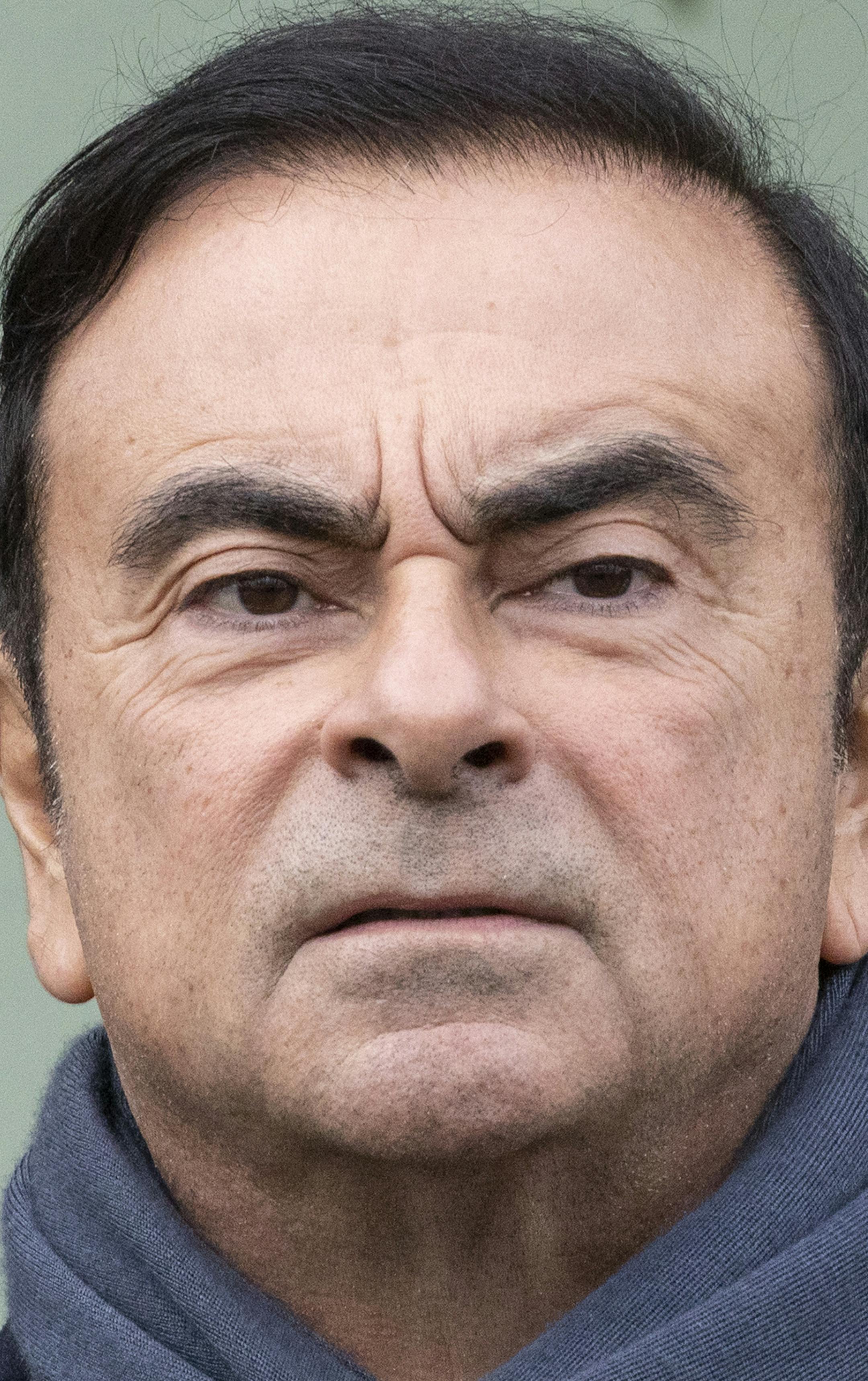 Renault CEO Carlos Ghosn waits for French President Emmanuel Macron before visiting the Renault factory in Maubeuge northern France, Thursday Nov. 8 2018. (Etienne Laurent, Pool via AP) ORG XMIT: NYOTK