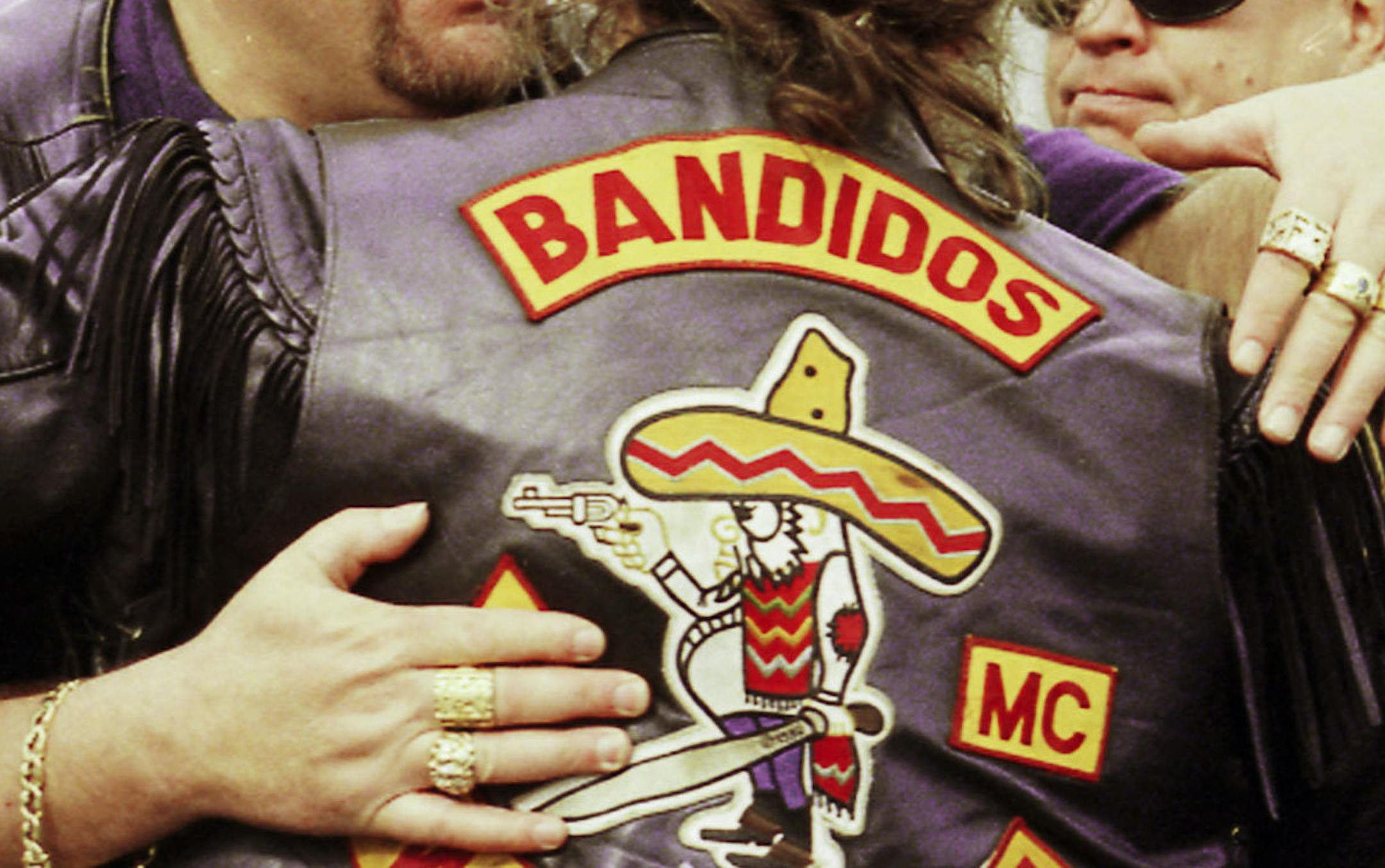 *** FILE ****George Wegers, left, national and international president of the Bandidos Outlaw Motorcycle Organization, embraces club member Bobby Lund of Bremerton at the service for Michael "Tennesee Mike" Vogt Monday, March 22, 1999, at the American Legion Hall in Bellingham, WA . Wegers was arrested Thursday , June 9, 2005 in a law enforcement investigation of the Bandidos. (AP Photo by The Bellingham Herald / Pete Kendall) ORG XMIT: WABEL103