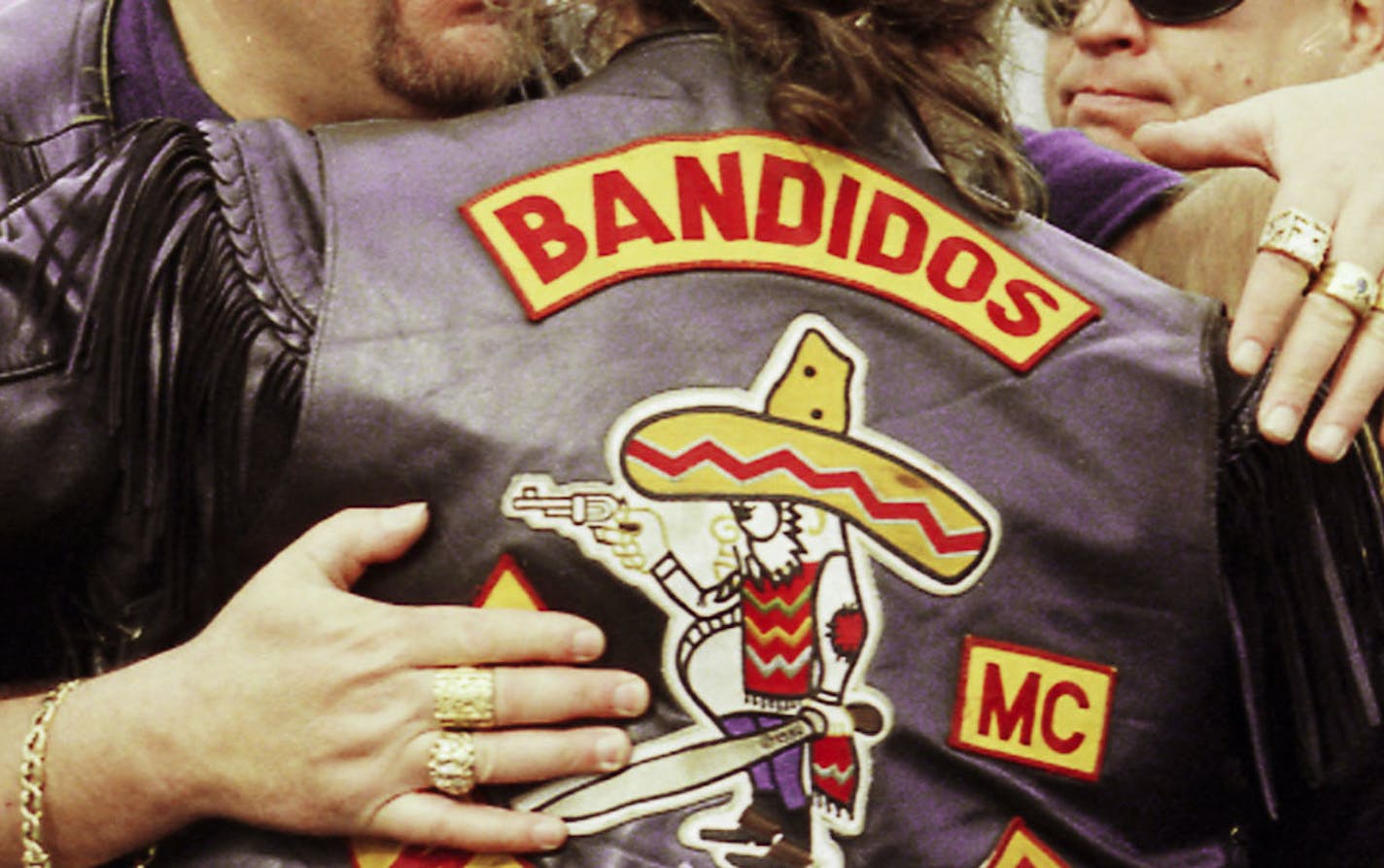 *** FILE ****George Wegers, left, national and international president of the Bandidos Outlaw Motorcycle Organization, embraces club member Bobby Lund of Bremerton at the service for Michael "Tennesee Mike" Vogt Monday, March 22, 1999, at the American Legion Hall in Bellingham, WA . Wegers was arrested Thursday , June 9, 2005 in a law enforcement investigation of the Bandidos. (AP Photo by The Bellingham Herald / Pete Kendall) ORG XMIT: WABEL103